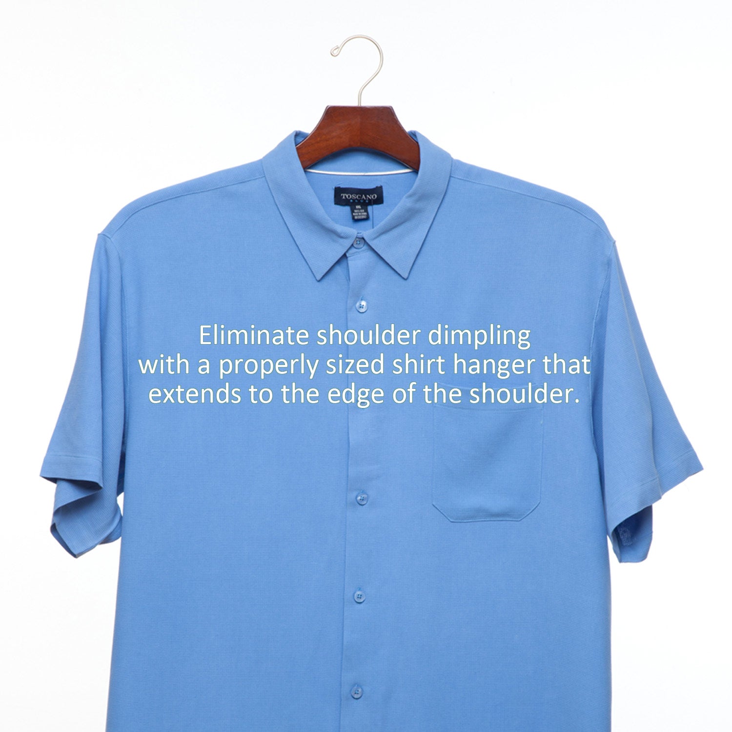 A blue shirt hangs on a Luxury Wooden Shirt Hanger (Set of 5) from KirbyAllison.com with the words eliminate shoulder drooping, ensuring a perfect fit.