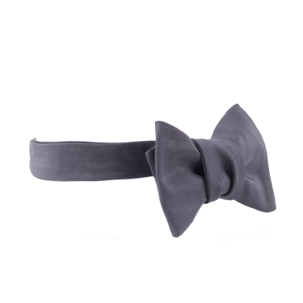 A handmade Sovereign Grade Jumbo Barathea Butterfly Bow Tie from KirbyAllison.com on a white background for a formal occasion.