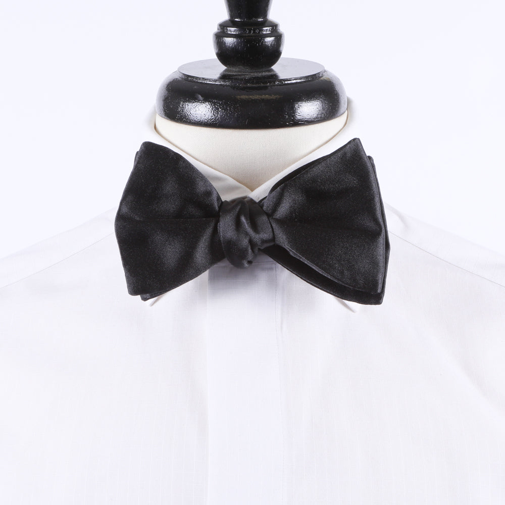 A formal Sovereign Grade Jumbo Satin Butterfly Bow Tie by KirbyAllison.com on a mannequin.