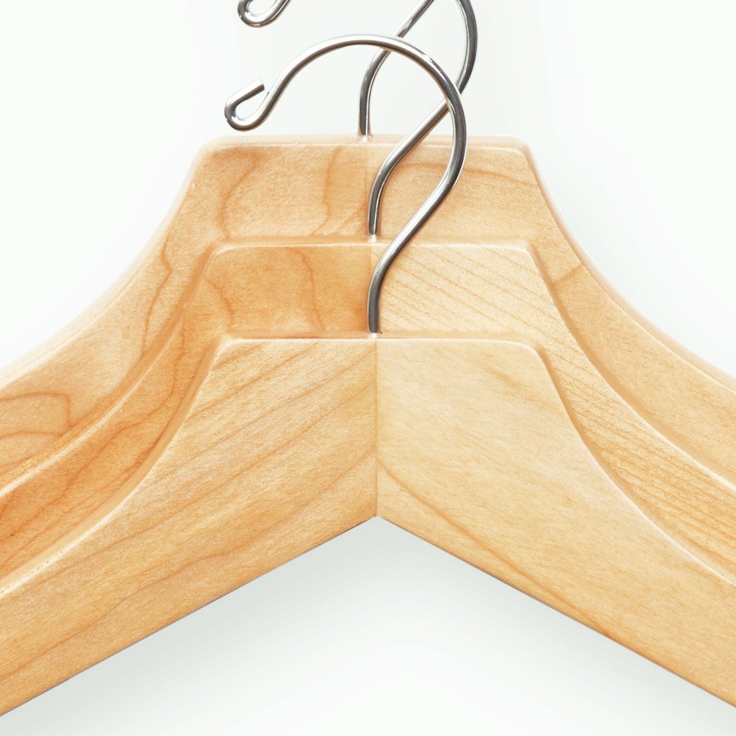 Three Extra-Large 21" Luxury Wooden Sweater and Polo Hangers with shoulder flocking on a white background by KirbyAllison.com.