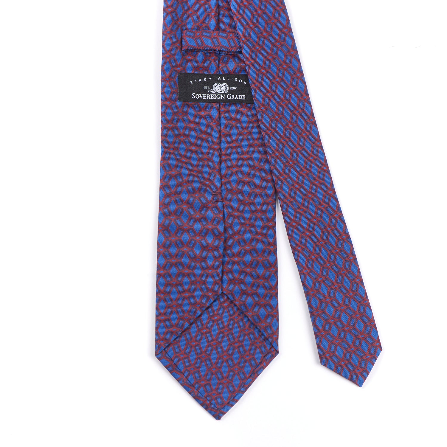 KirbyAllison.com's Sovereign Grade Rust Ancient Madder Tie, 150cm with a blue and red geometric pattern.