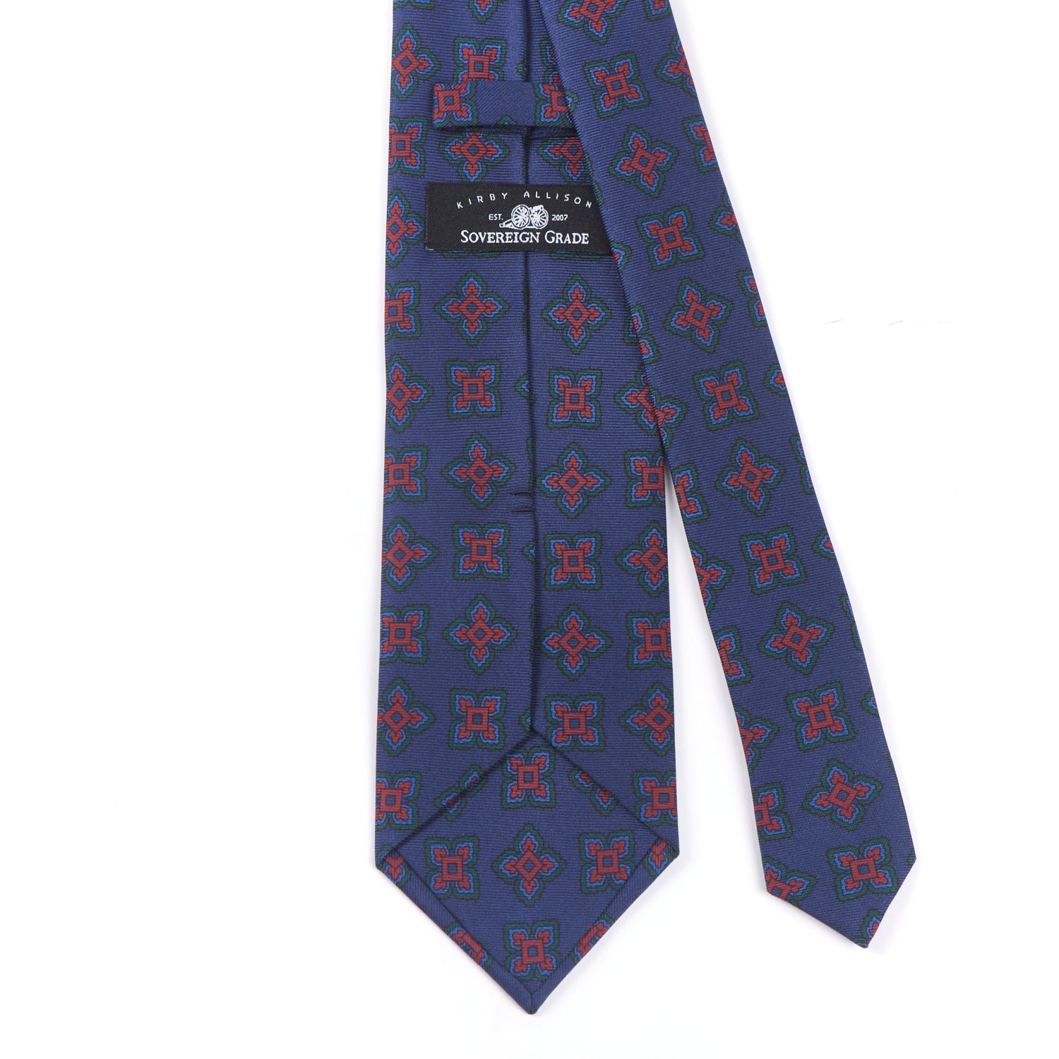 A Sovereign Grade Navy Large Medallion Ancient Madder Tie, 150cm by KirbyAllison.com, with blue and red designs, known for its longevity.