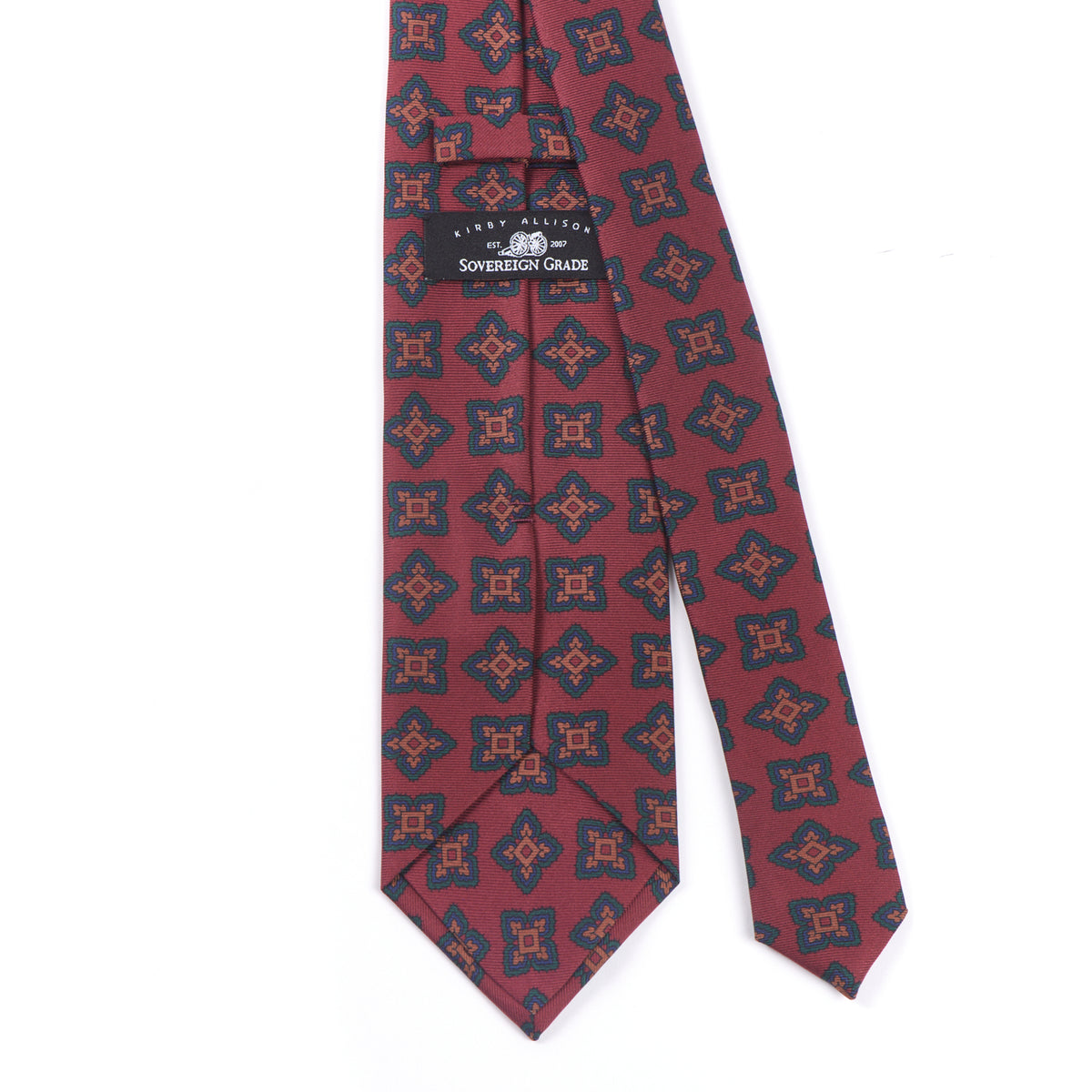 A KirbyAllison.com Sovereign Grade Rust Large Medallion Ancient Madder Tie, 150cm with a timeless black and red pattern.