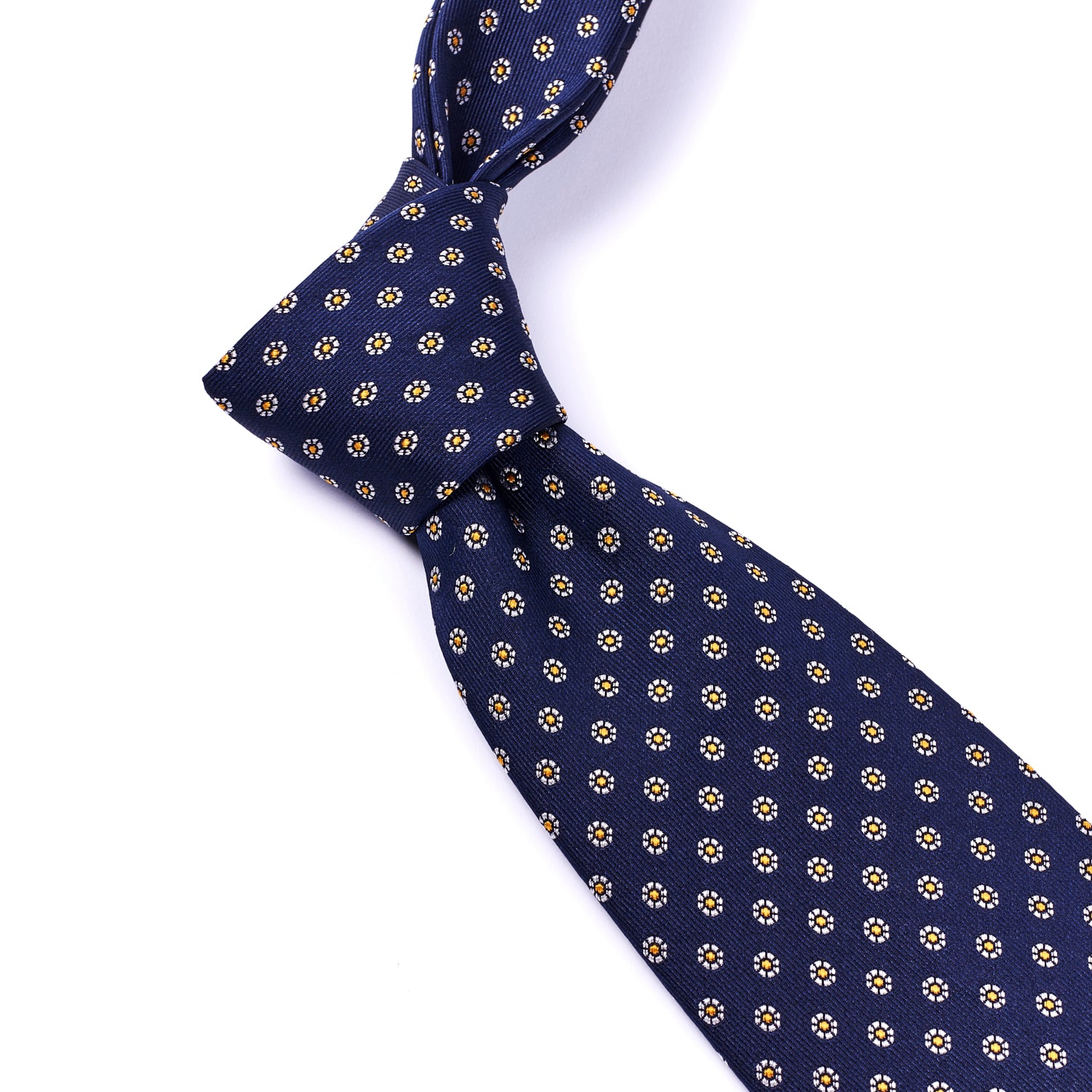 A handmade Sovereign Grade Midnight Navy Floral Jacquard Tie, 150 cm with gold dots, known for its quality, by KirbyAllison.com.