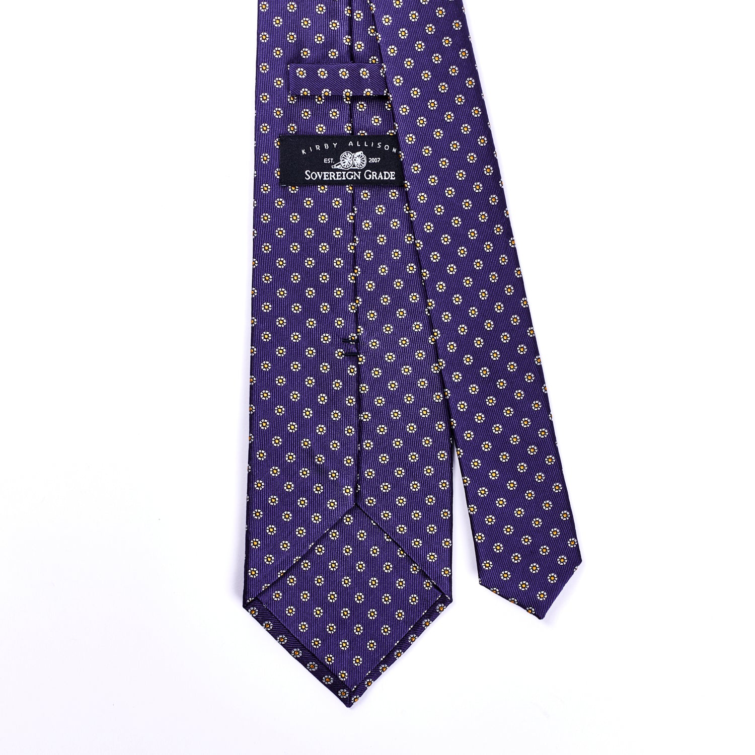 A Sovereign Grade Plum Floral Jacquard tie in purple and gold on a white background, from KirbyAllison.com.