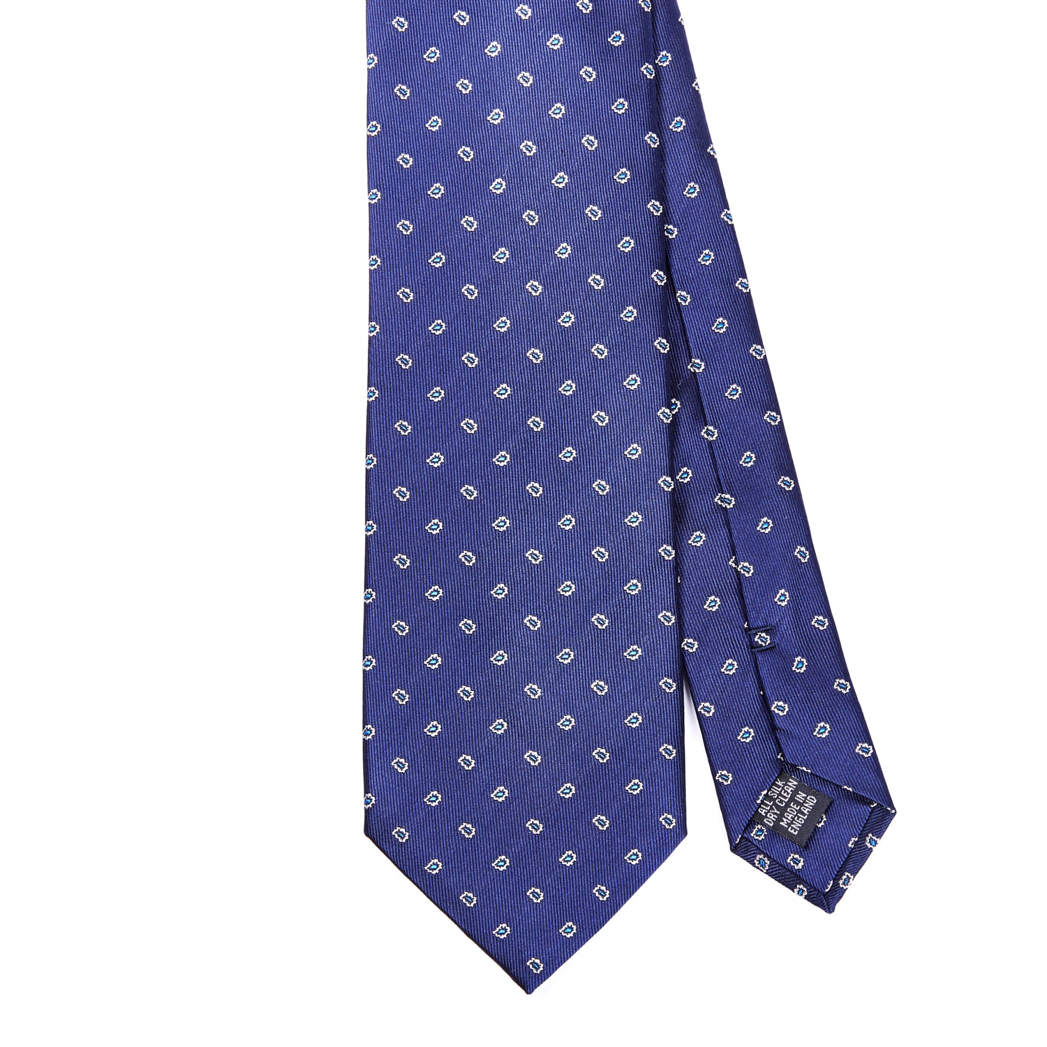 Handmade in the United Kingdom, the Sovereign Grade Navy Micro Paisley Jacquard Tie, 150 cm from KirbyAllison.com features white dots and is crafted with 100% English silk.