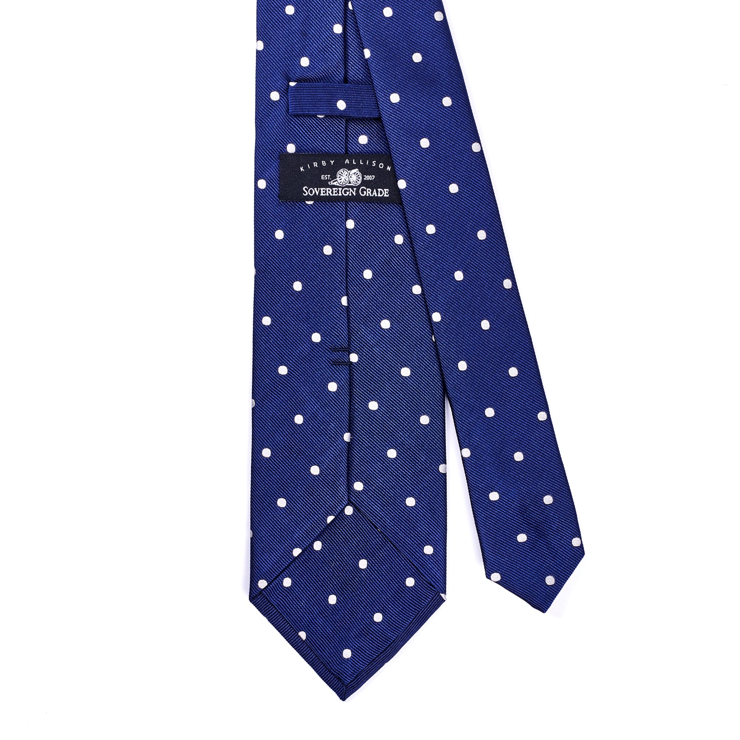 A KirbyAllison.com Sovereign Grade Woven Navy/White Wide Dot Tie, 150 cm on a white background, ideal for the United Kingdom.