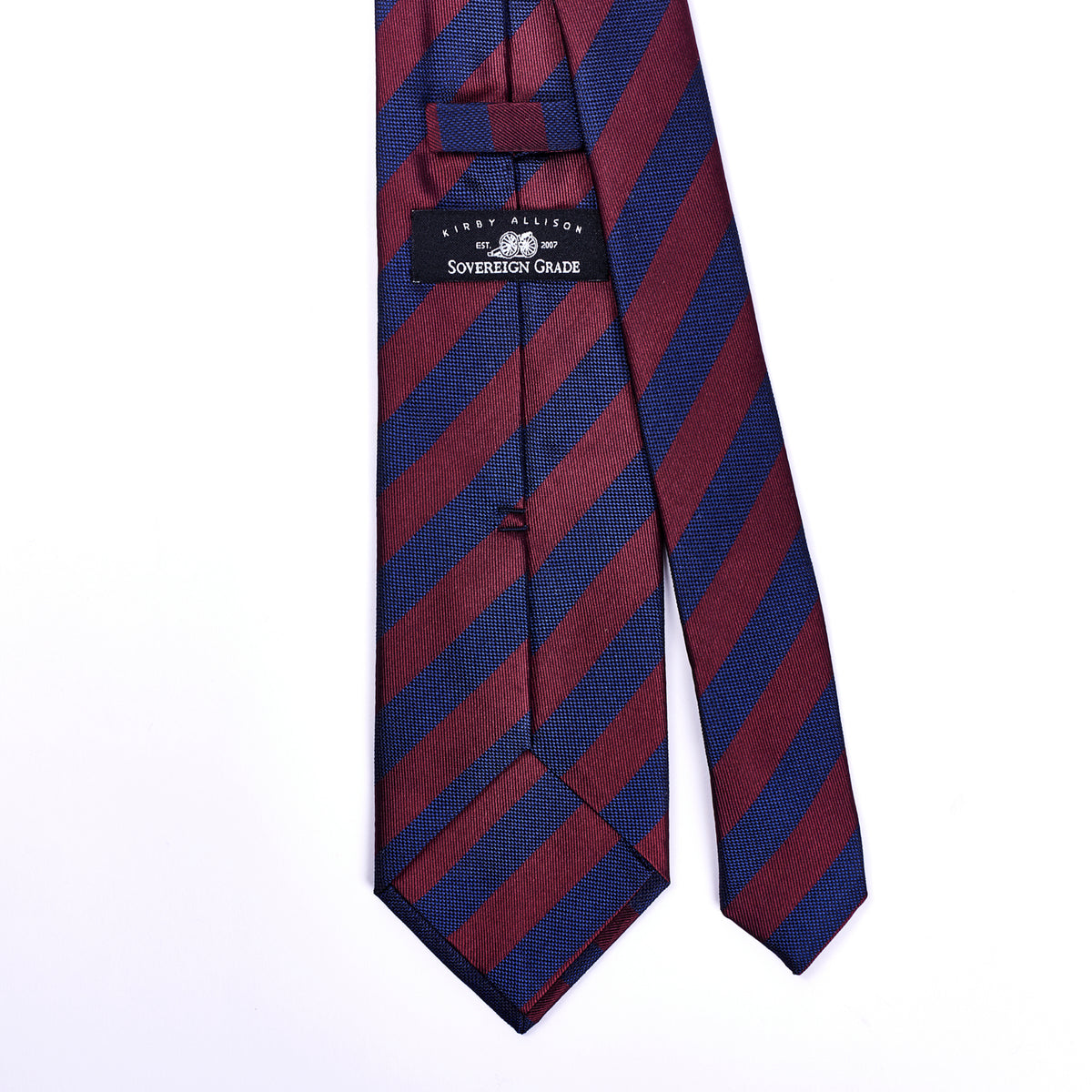 A red and blue striped KirbyAllison.com Sovereign Grade Woven Navy and Burgundy Rep Tie, 150 cm handmade in the United Kingdom.