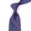 A Sovereign Grade Navy 50 oz Art Deco Tie, 150 cm with a blue and red pattern, crafted in the United Kingdom by KirbyAllison.com.