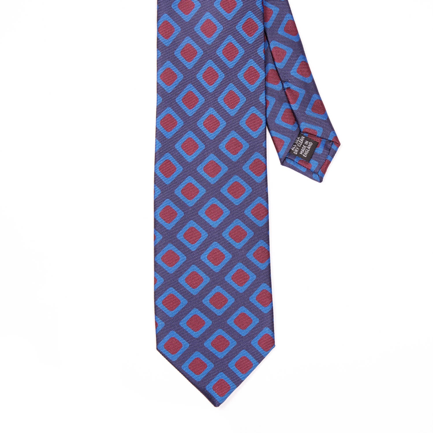 A Sovereign Grade Navy 50 oz Art Deco Tie, 150 cm from KirbyAllison.com, with a geometric pattern in blue and red, known for its quality.