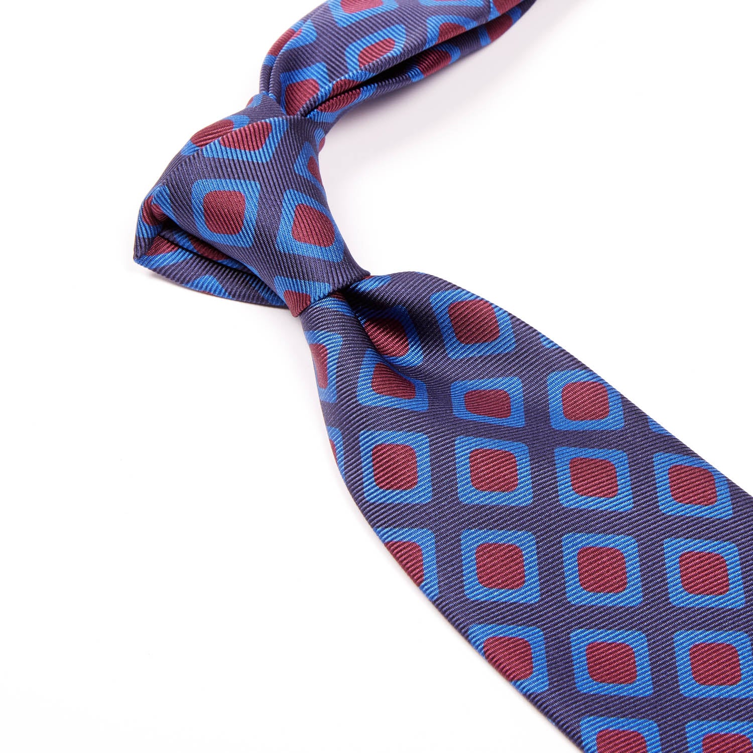 A Sovereign Grade Navy 50 oz Art Deco Tie, 150 cm with blue and red squares on a white background from KirbyAllison.com.