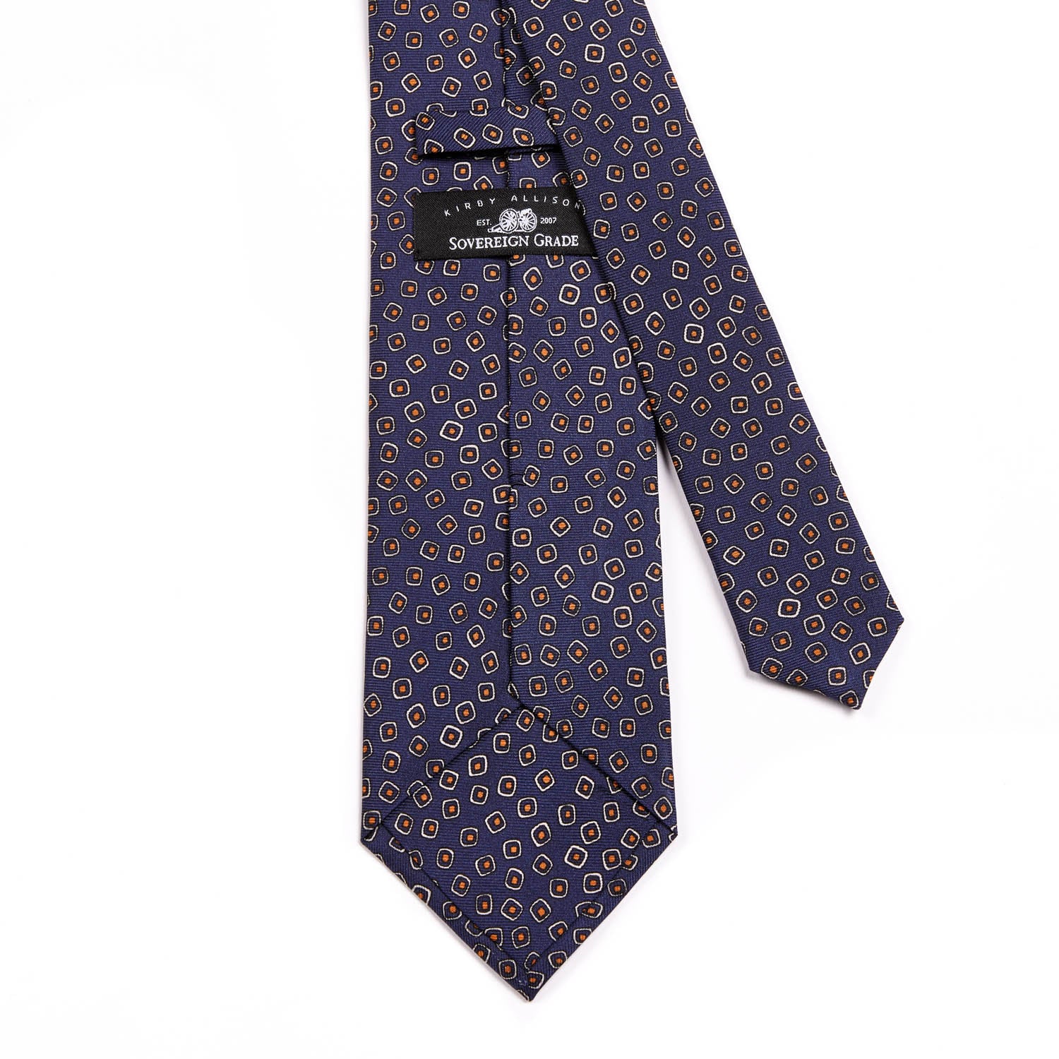 A Sovereign Grade Navy/White Eton Printed Silk Tie, 150cm made of 100% English silk with a pattern, handmade in the United Kingdom from KirbyAllison.com.