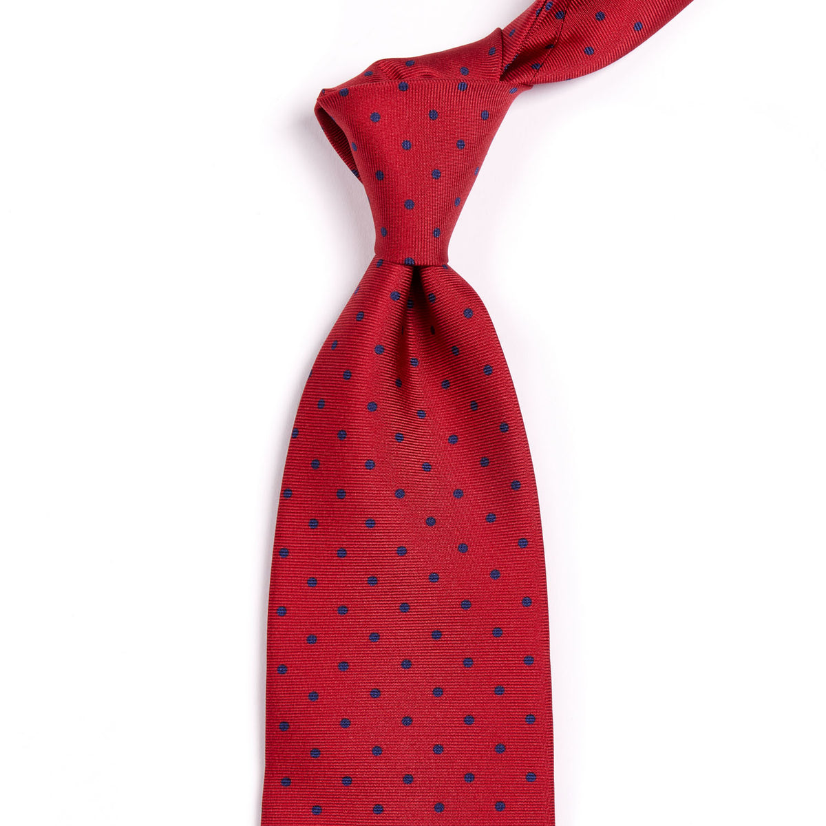 A KirbyAllison.com Sovereign Grade Red London Dot Printed Silk Tie, 150cm from the United Kingdom with quality red and blue dots on a white background.