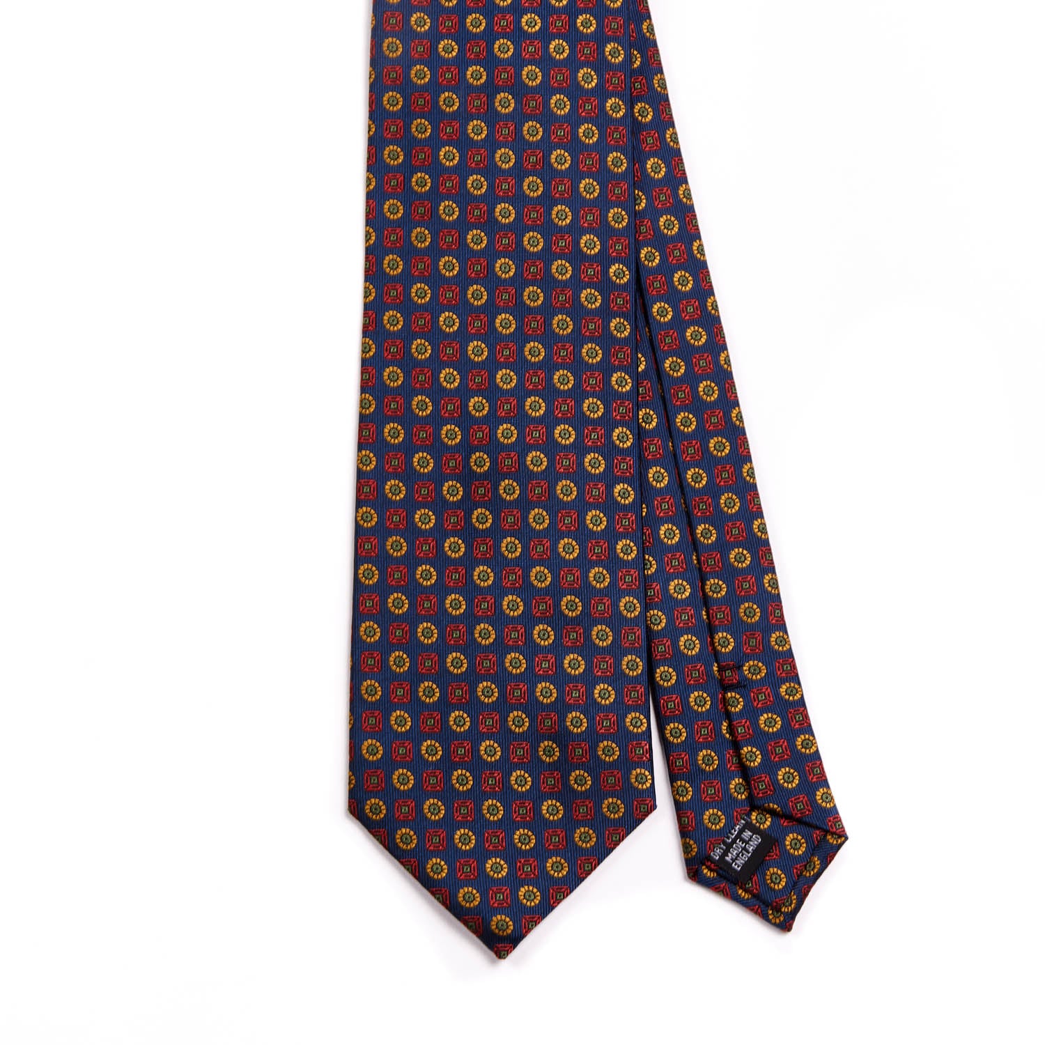 A Sovereign Grade Navy Floral Jacquard Tie, 150 cm by KirbyAllison.com with a red, blue, and yellow pattern providing longevity to your style.