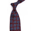 A Sovereign Grade Oxblood Art Deco Jacquard Tie, 150 cm with blue squares, showcasing quality craftsmanship from KirbyAllison.com.