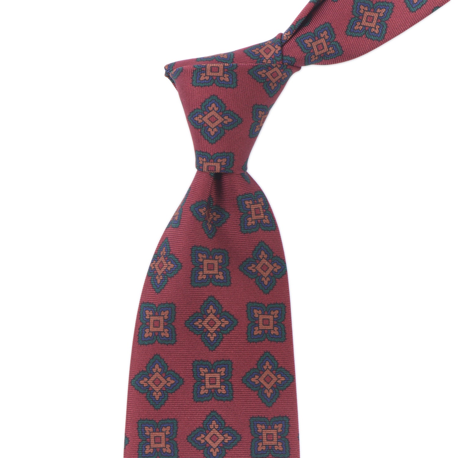 A high-quality Sovereign Grade Rust Large Medallion Ancient Madder tie, 150cm by KirbyAllison.com with intricate black and blue designs.