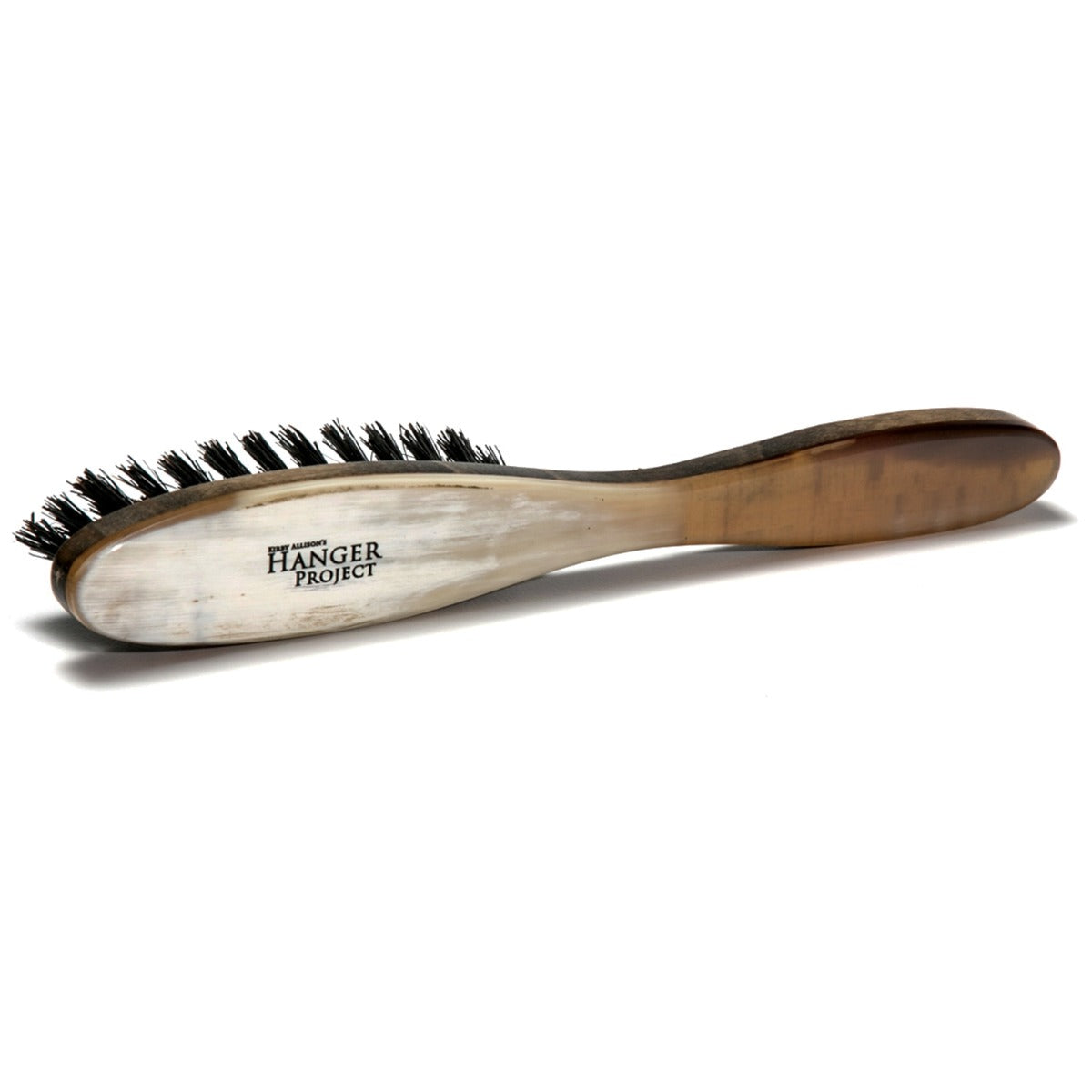 A Wellington Horn-Backed Suede Cleaning Brush with a wooden handle for maintaining suede items, available at KirbyAllison.com.