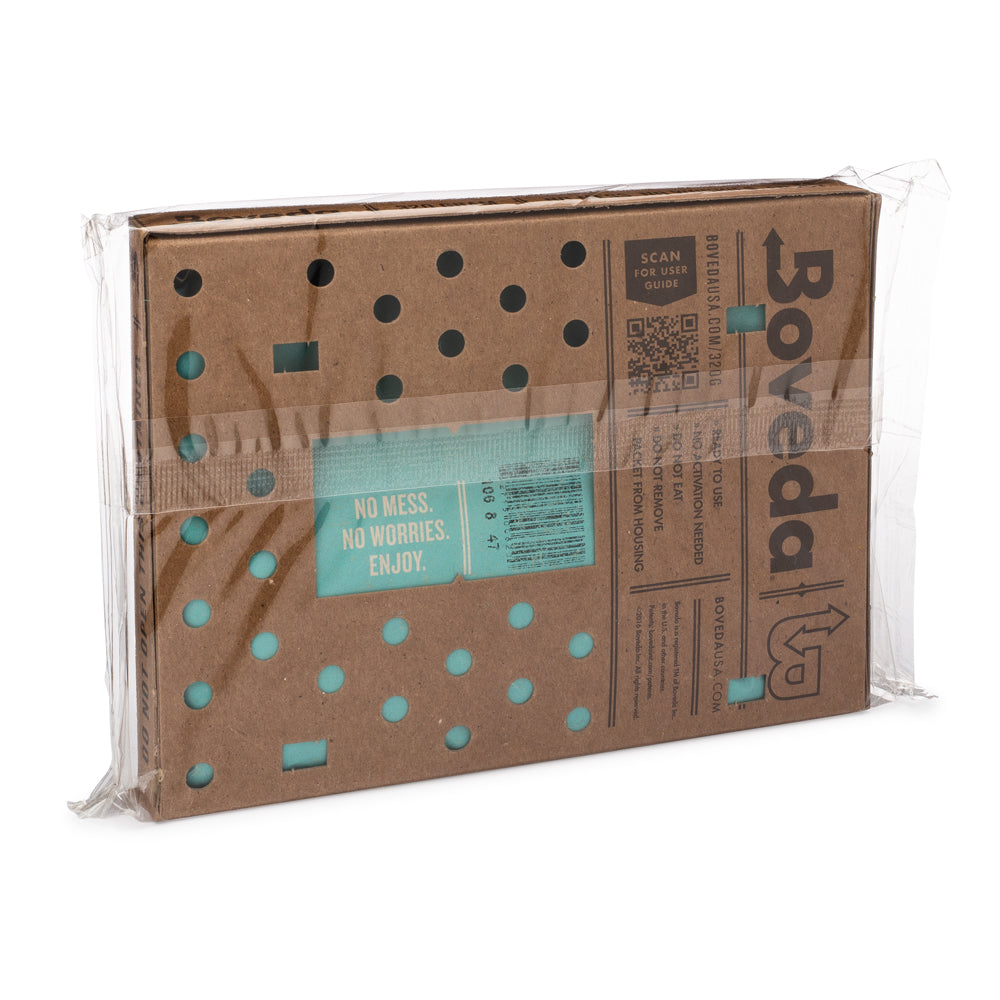 A cardboard box for long-term cigar storage with a polka dot pattern on it, with the Large Boveda Humidity Pouch (320 Gram) from KirbyAllison.com.