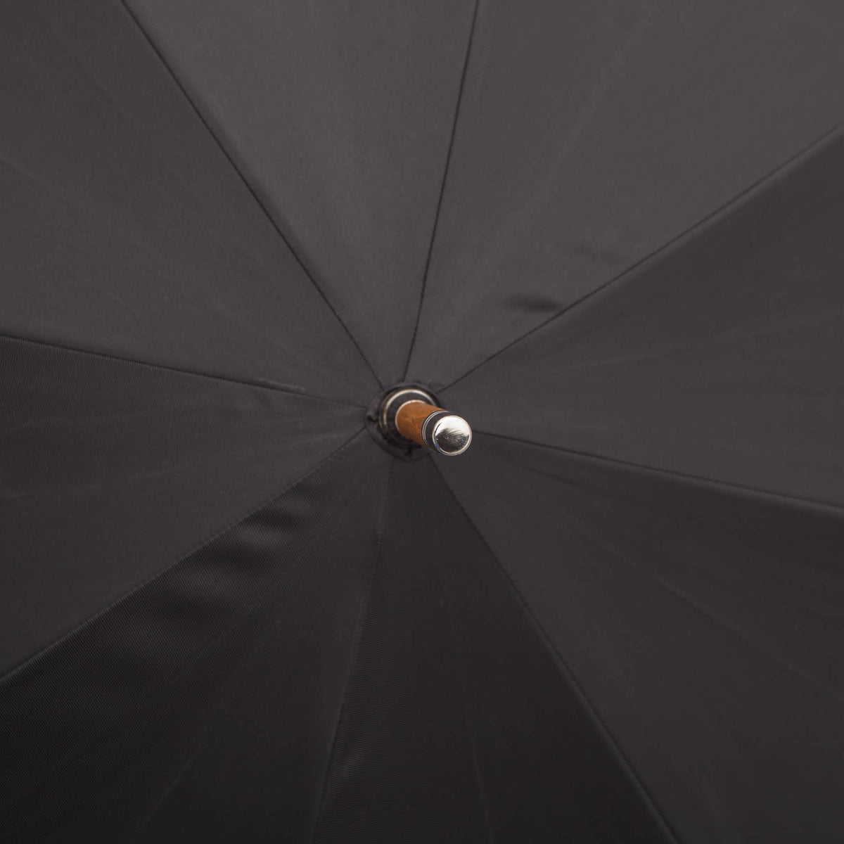 A KirbyAllison.com Black Doorman Umbrella with a black canopy.