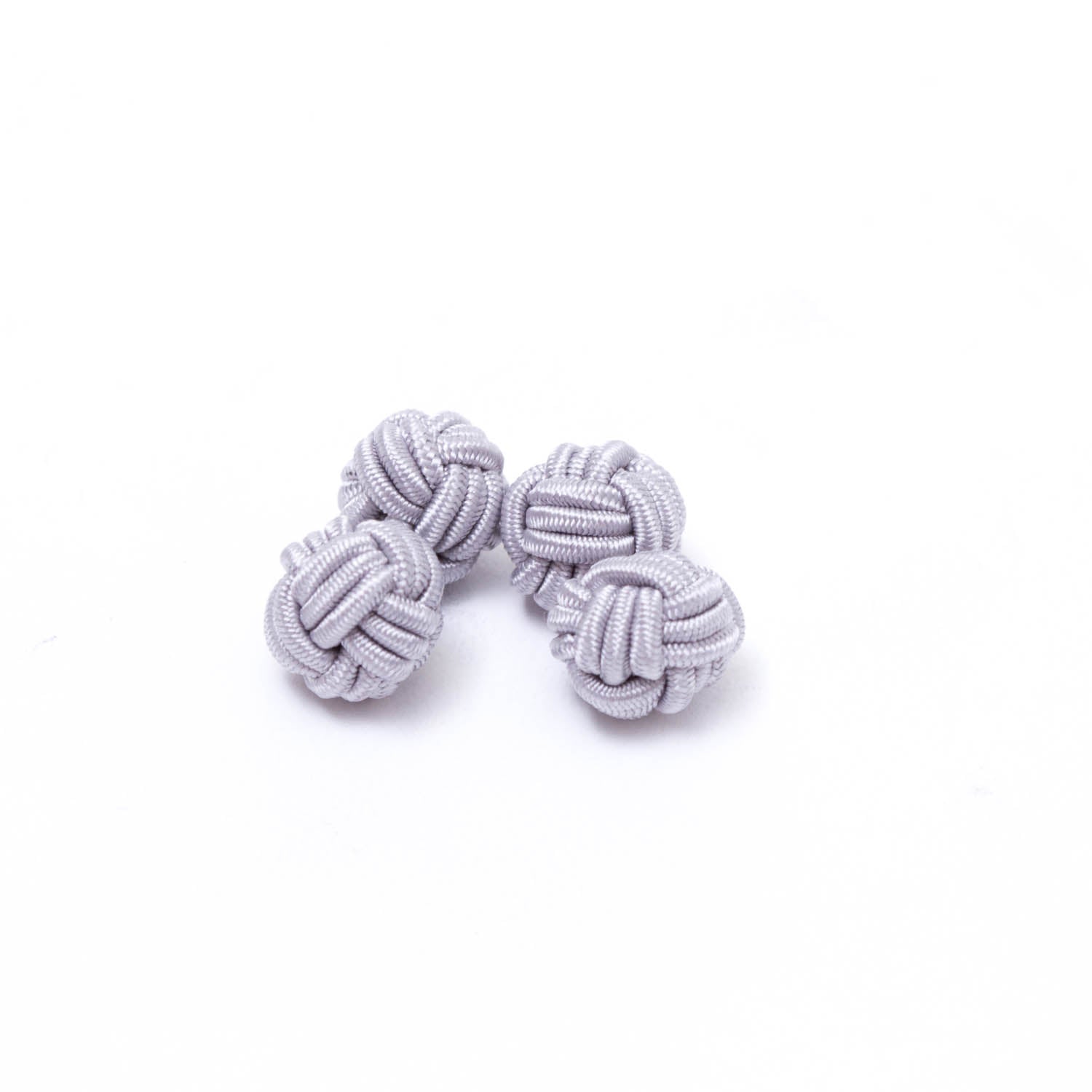 KirbyAllison.com's Solid Knot Cuff Links on a white surface.