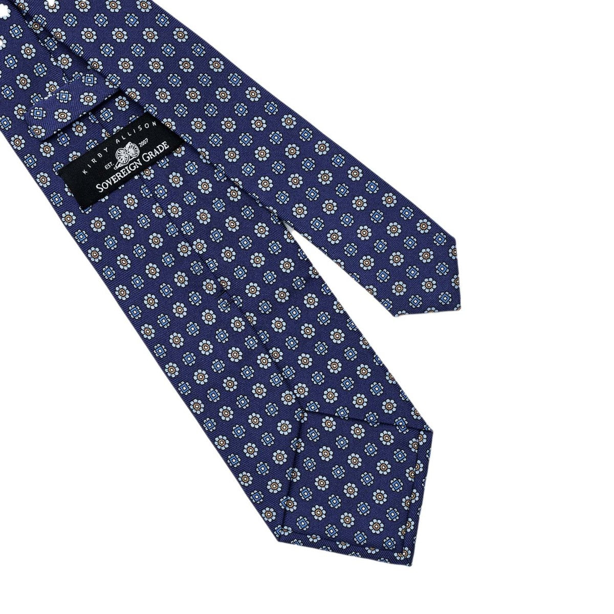 A handmade Sovereign Grade Navy Floral 36oz Printed Silk Tie with a pattern on it, made of 100% English silk (from the KirbyAllison.com ties collection).