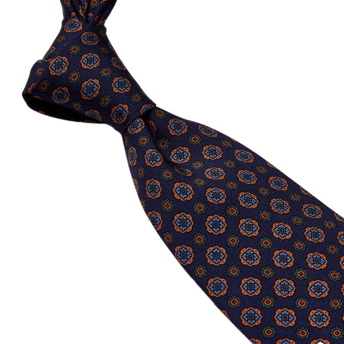 A Sovereign Grade Navy Geometric Floral 36oz Printed Silk Tie, from KirbyAllison.com, with an orange and blue pattern, showcasing quality craftsmanship from the United Kingdom.