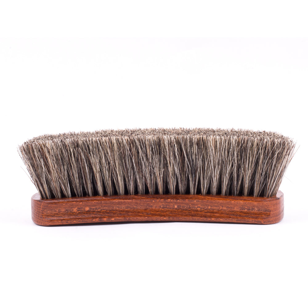 A Deluxe Wellington Horsehair Buffing Brush with a wooden handle on a white background by KirbyAllison.com.