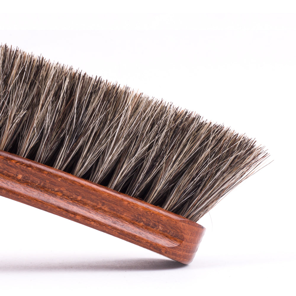 A close up of a Deluxe Wellington Horsehair Buffing Brush with horsehair from KirbyAllison.com.