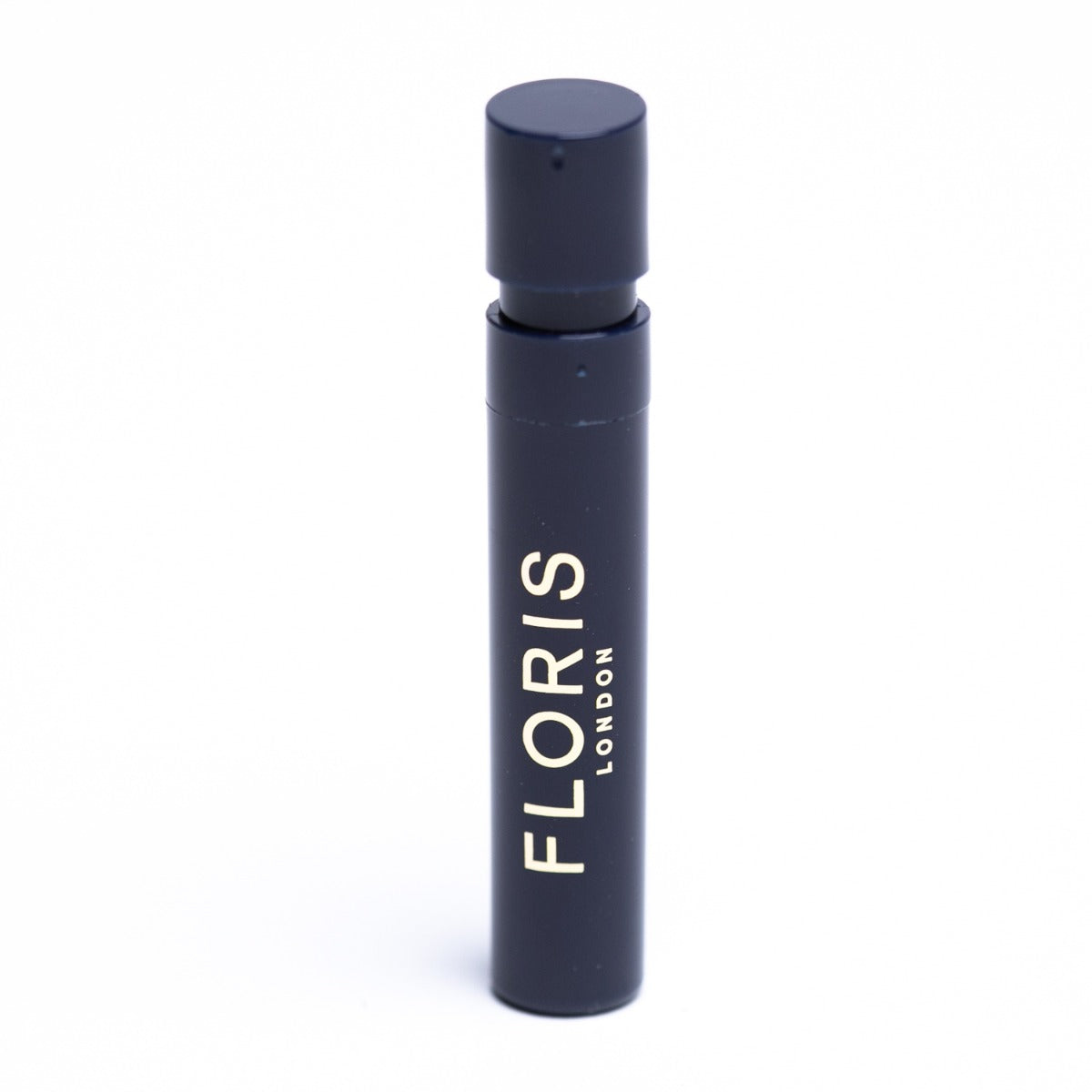 A black bottle with the word FLORIS Santal Sample Vials by KirbyAllison.com on it, containing fragrance samples.