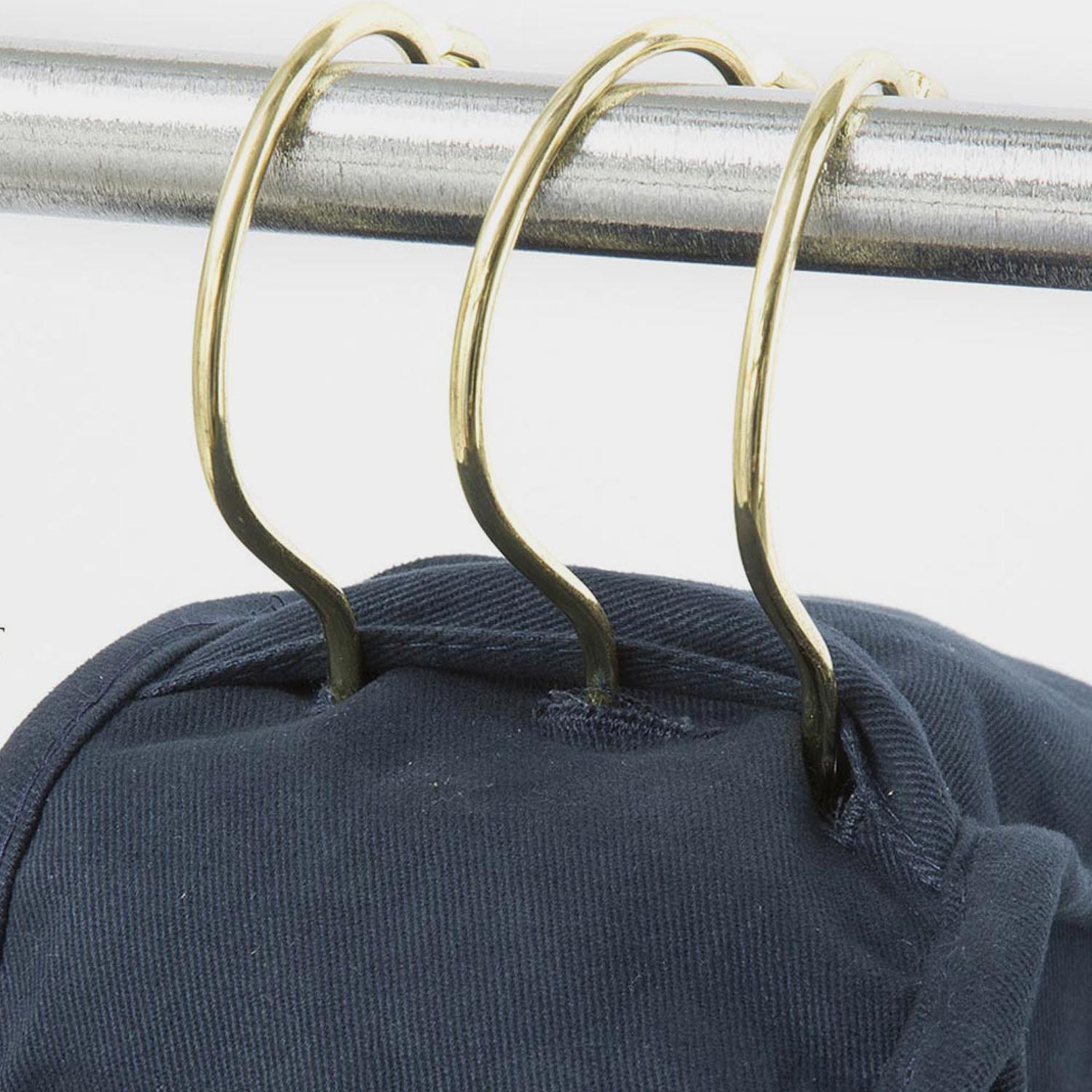 A blue cotton hoodie hangs inside a Luxury Garment Storage Bag from KirbyAllison.com.