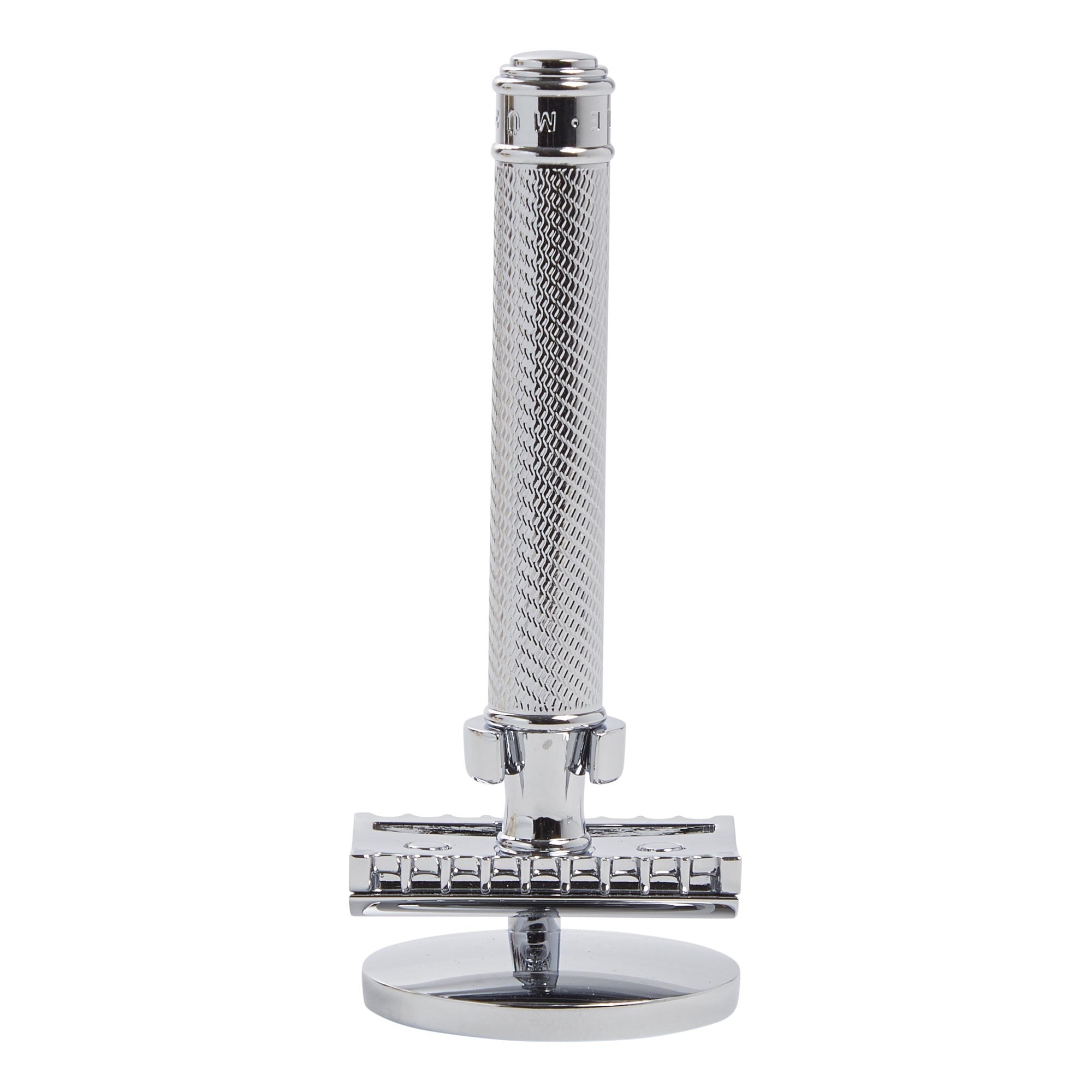 A Muhle Safety Razor Stand from KirbyAllison.com, made of stainless steel, on a white background, displayed with an elegant man's bathroom aesthetic.