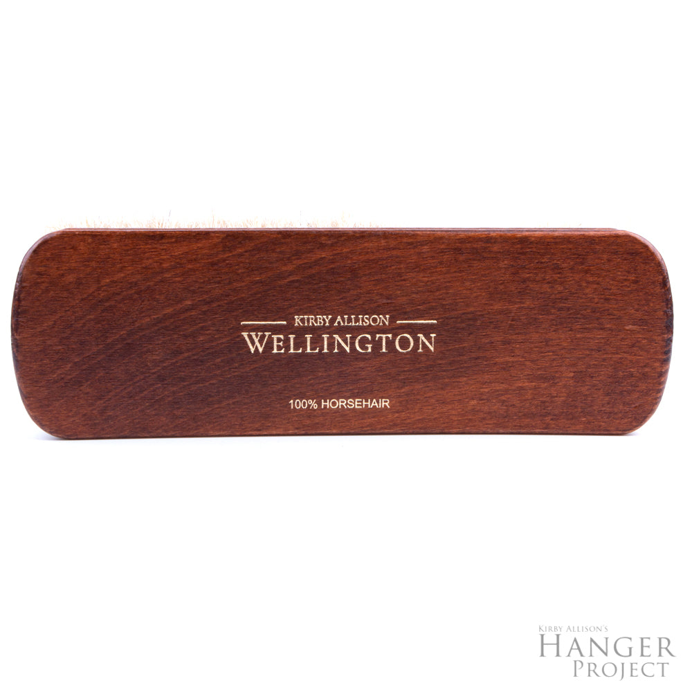 A wooden box with the words "Extra-Large Wellington Horsehair Shoe Polishing Brush" on it, containing a horsehair shoe polishing brush made by KirbyAllison.com.