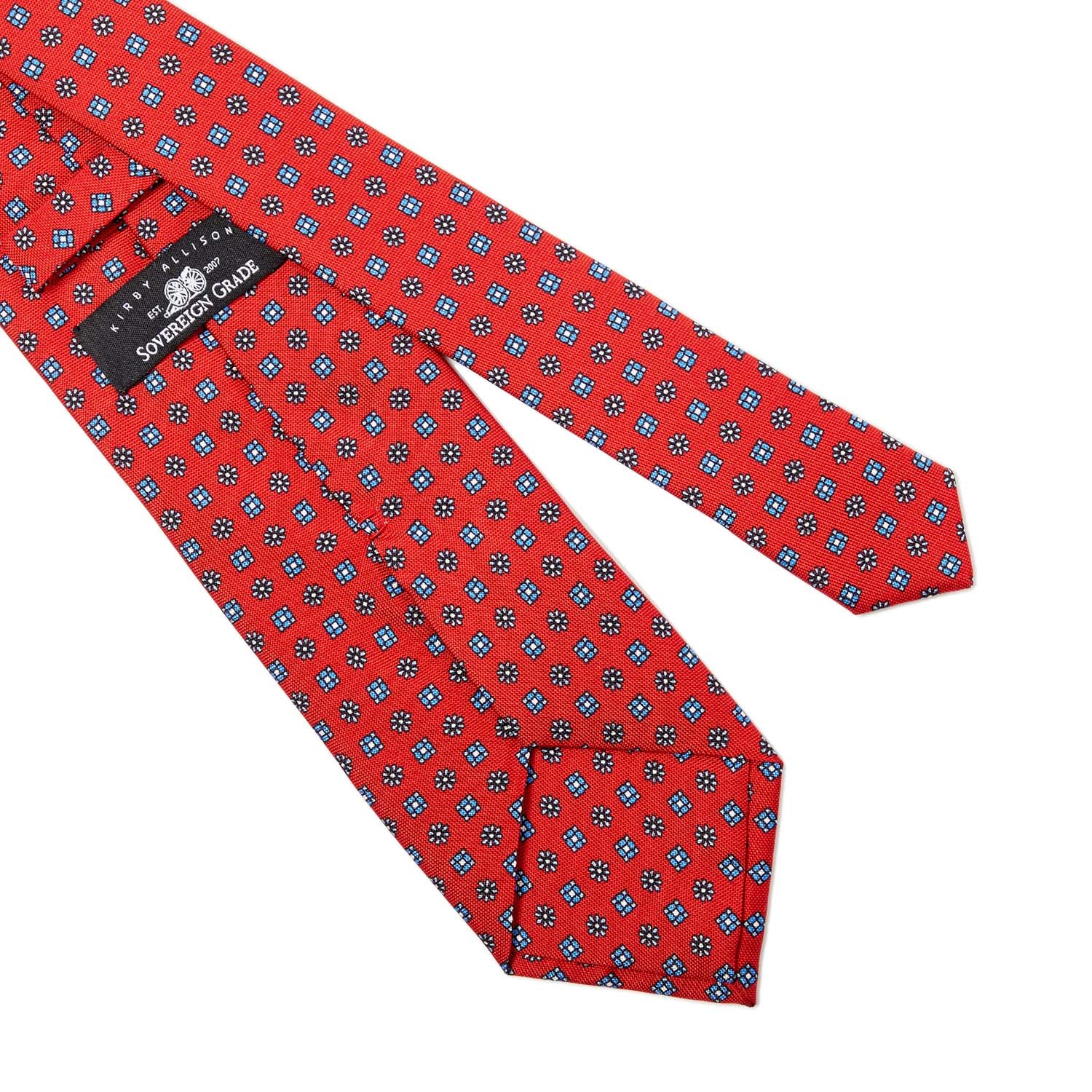 A Sovereign Grade Red Floral 25oz Silk Hopsack Tie with blue dots known for its quality by KirbyAllison.com.