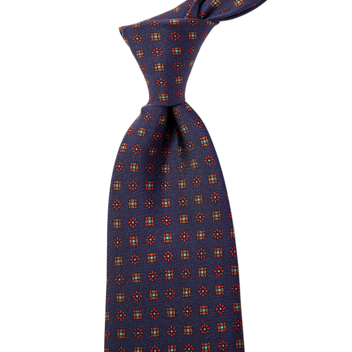 Handmade in the United Kingdom, this Sovereign Grade Navy Floral 25oz Silk Hopsack Tie (150x8.5 cm) from KirbyAllison.com features a red, orange, and blue pattern showcasing quality craftsmanship.