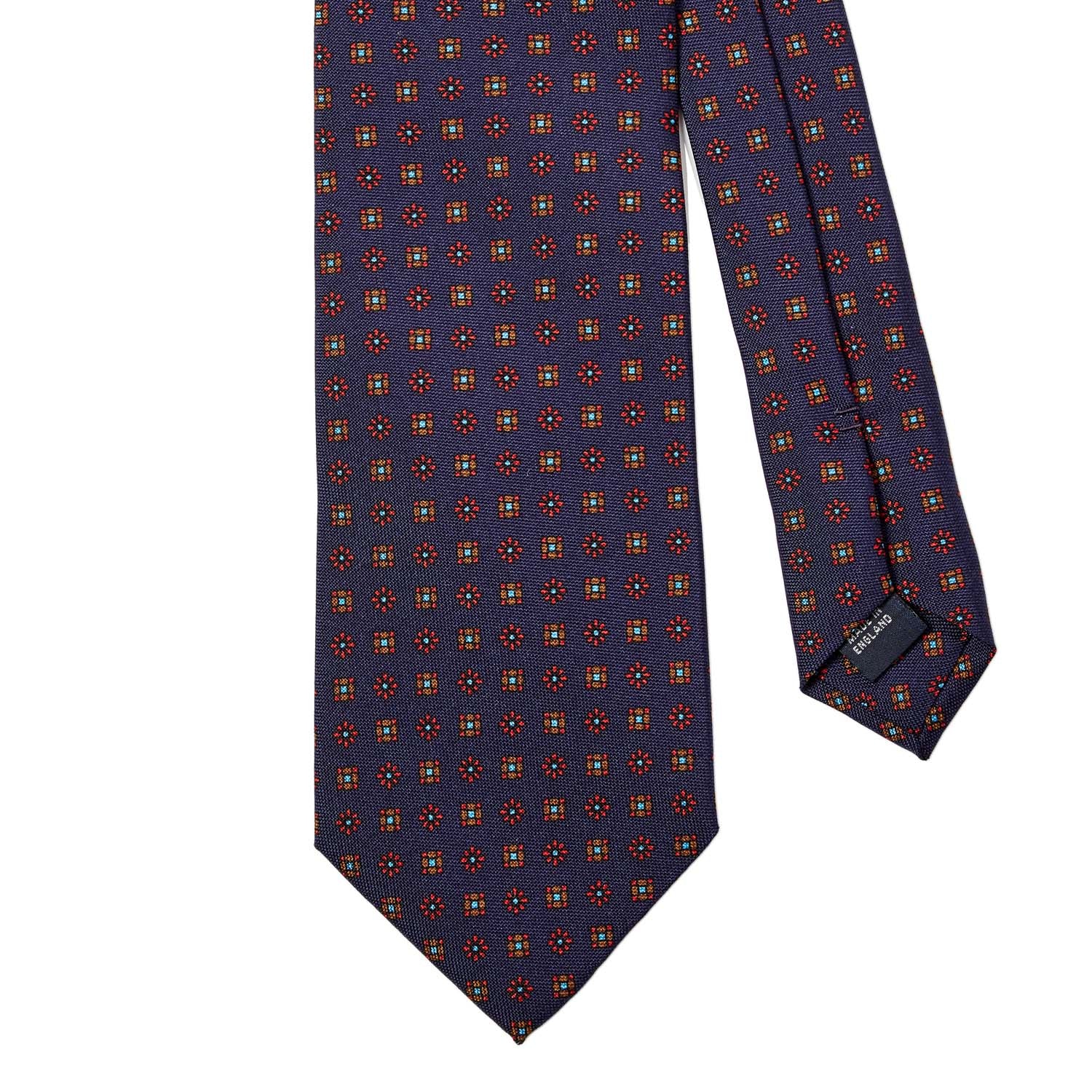 A Sovereign Grade Navy Floral 25oz Silk Hopsack Tie (150x8.5 cm) by KirbyAllison.com, with a red, orange, and blue pattern, showcasing quality craftsmanship.