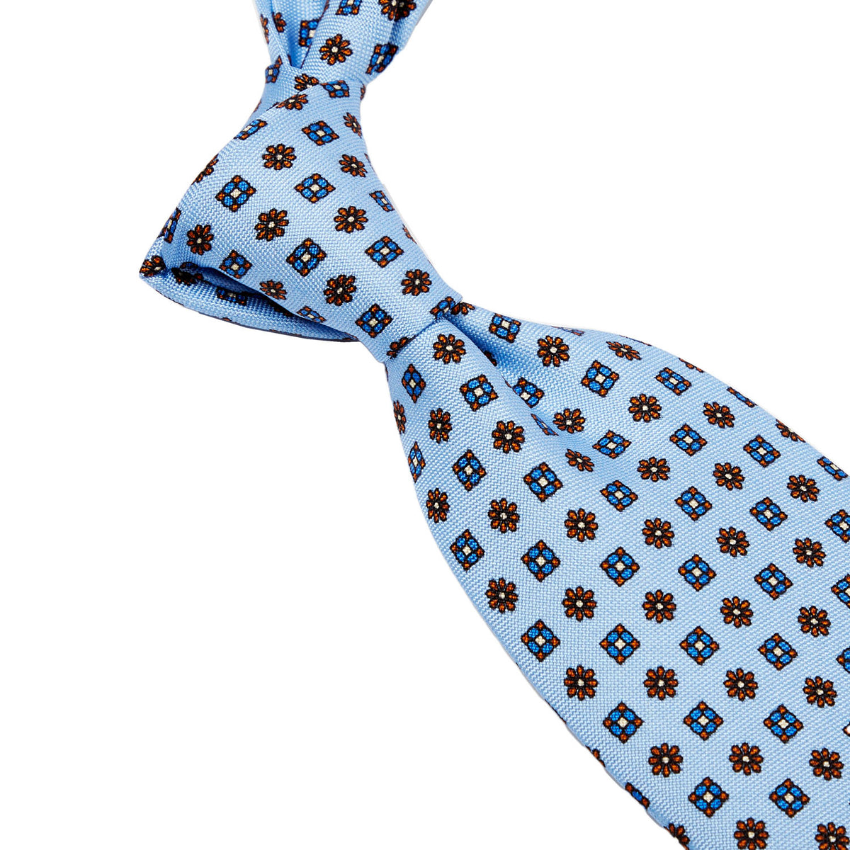 A Sovereign Grade Baby Blue Floral 25oz Silk Hopsack Tie (150x8.5 cm) from KirbyAllison.com with intricate brown and blue designs.