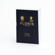 A black book with the logo of KirbyAllison.com on it that includes FLORIS Cefiro Sample Vials and a promo code.