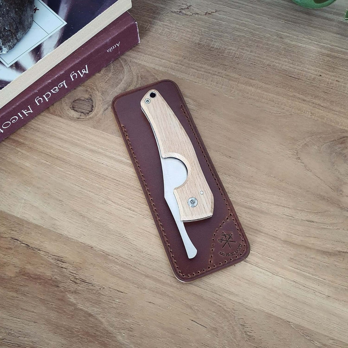 A Cigar Knife Tan Leather Case with a wooden handle in a leather sheath from KirbyAllison.com.