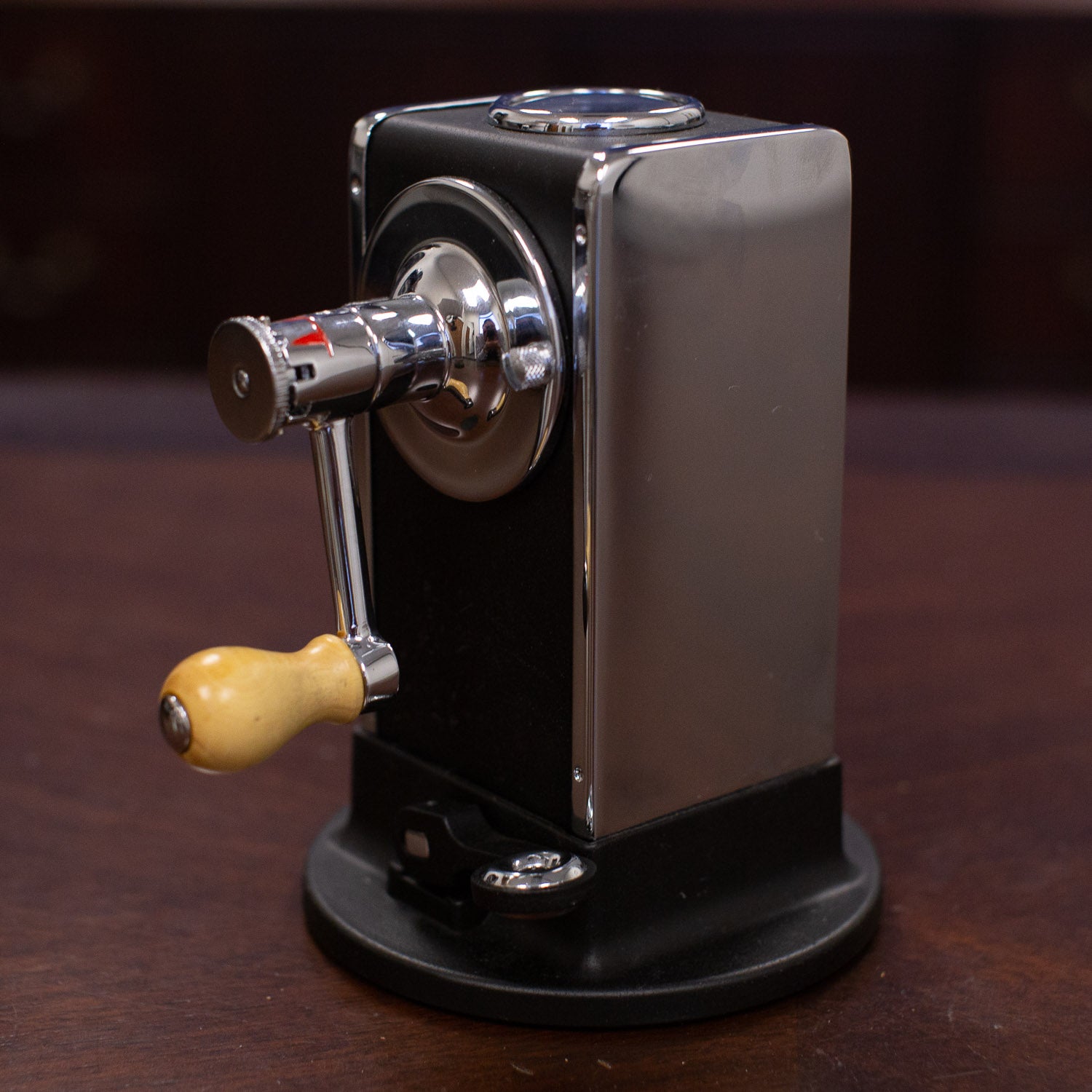 A small El Casco M-430 Pencil Sharpener sitting on a table, designed with mechanical engineering inspiration by KirbyAllison.com.