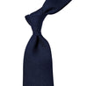 A handmade Sovereign Grade Grenadine Fina Navy Tie from KirbyAllison.com, made in the United Kingdom, on a white background.