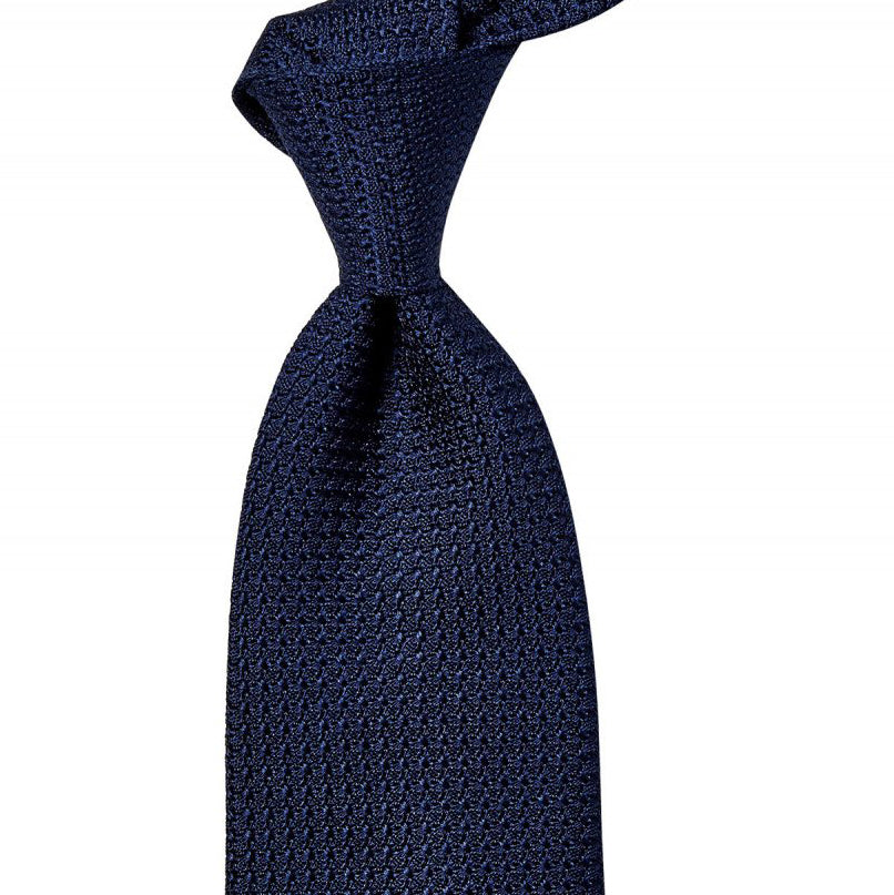 A Sovereign Grade Grenadine Grossa Navy Blue tie from KirbyAllison.com, crafted with quality in the United Kingdom, on a white background.