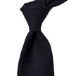 A Sovereign Grade Grenadine Grossa Midnight Blue Tie of quality handmade in the United Kingdom, showcased on a white background, available on KirbyAllison.com.