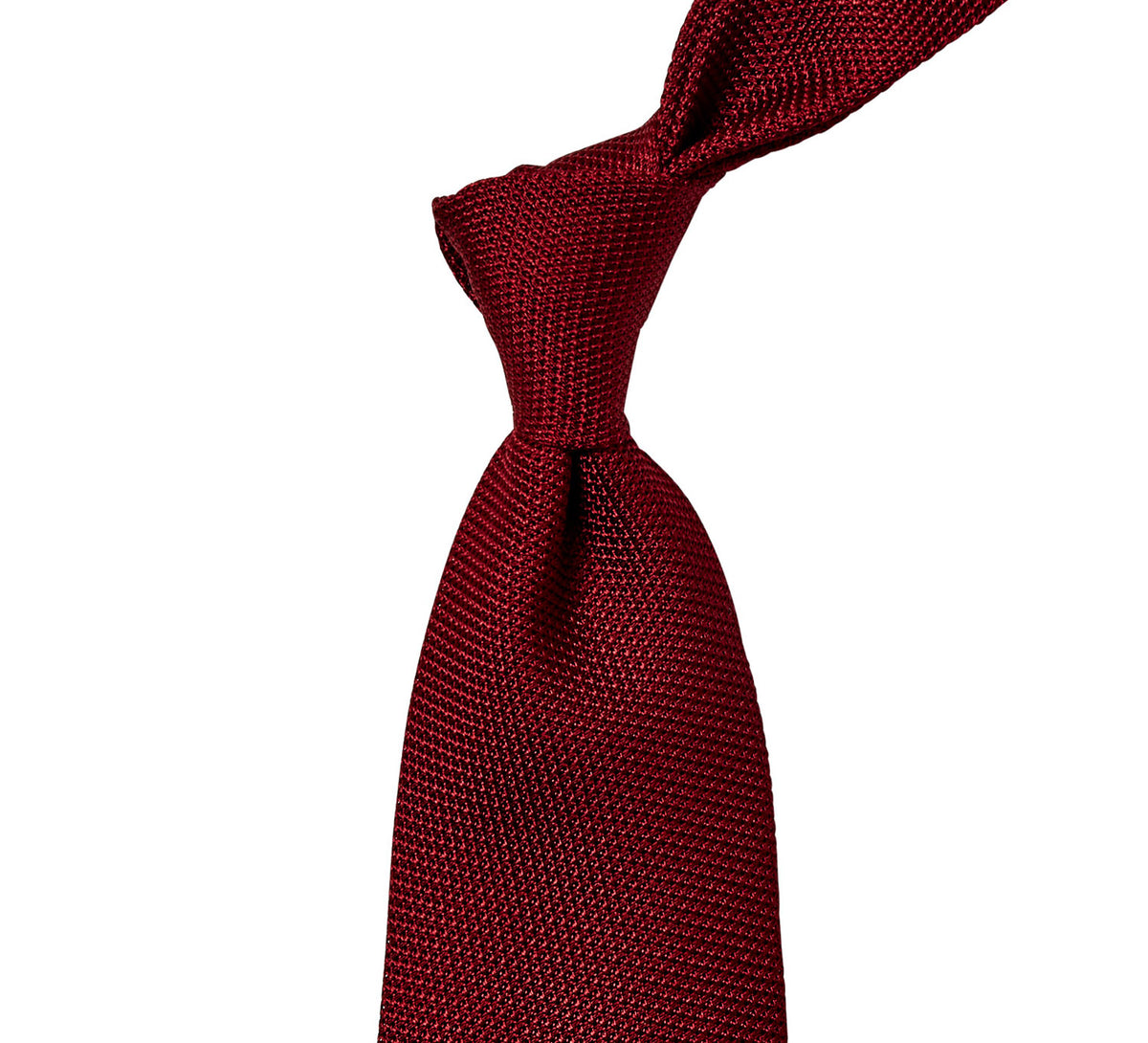 A Sovereign Grade Grenadine Fina Ruby Tie on a white background from KirbyAllison.com.