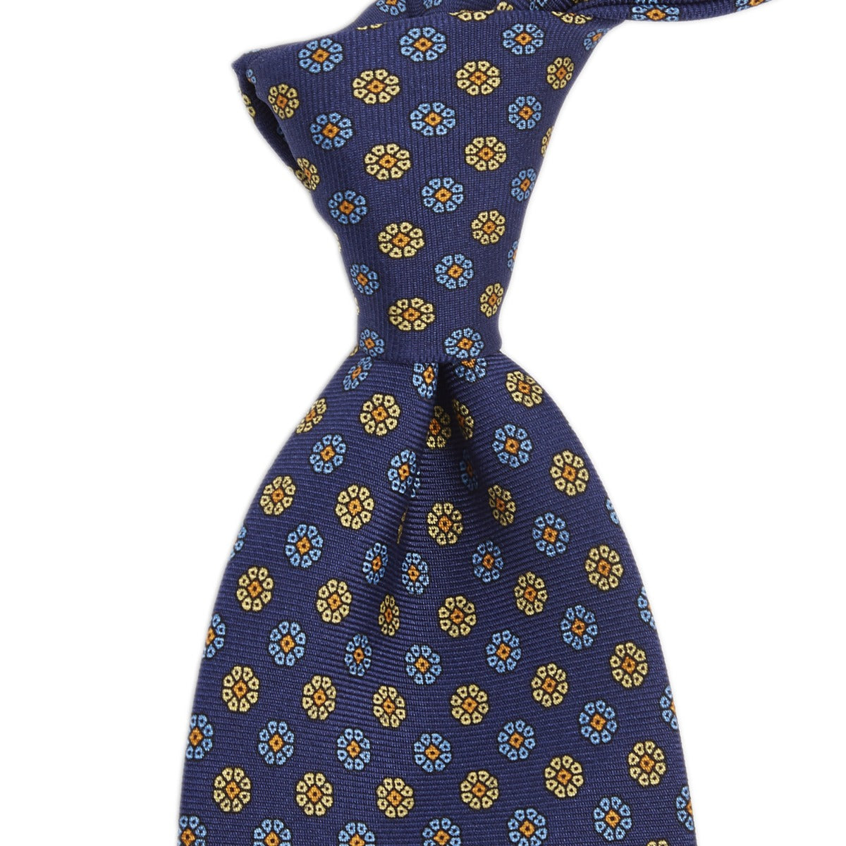 A Sovereign Grade Royal/Blue/Cream Maccesfield Corn Floral Motif tie with handmade craftsmanship and blue flowers, made by KirbyAllison.com.
