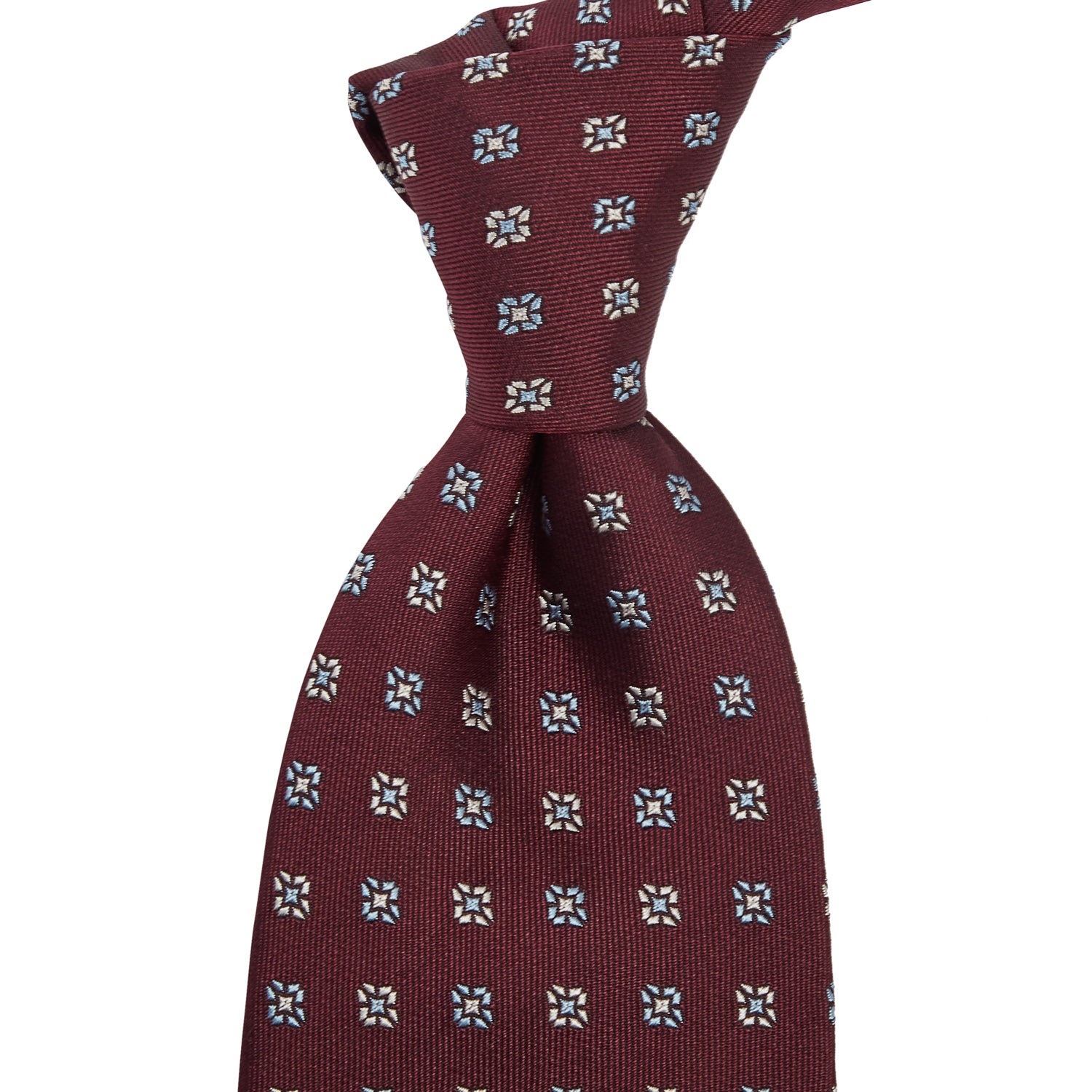 A Sovereign Grade Oxblood Square Floral Jacquard Tie by KirbyAllison.com with blue and white flowers on it.