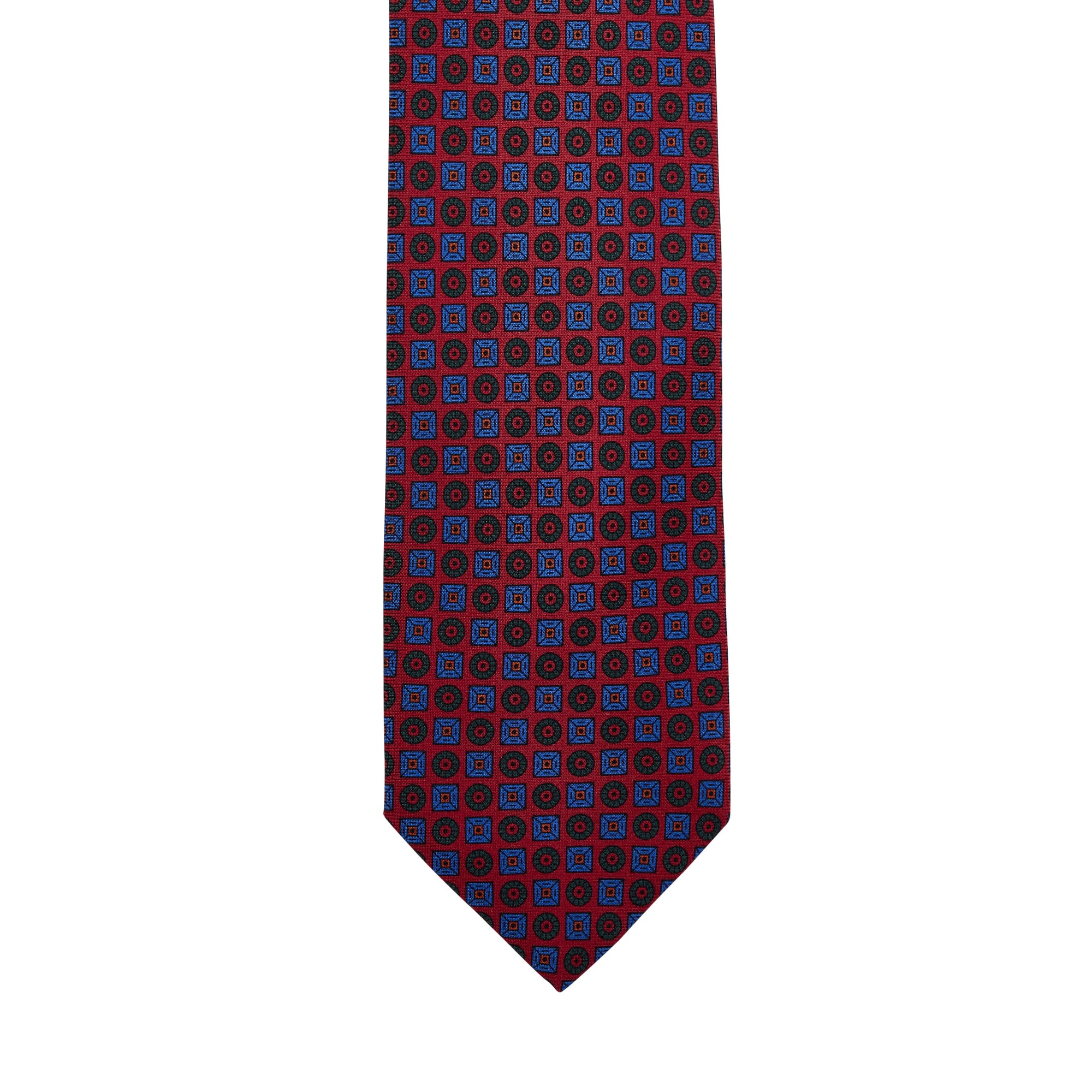 A quality Sovereign Grade Rust Ancient Madder Tie in red and blue on a white background, from KirbyAllison.com.