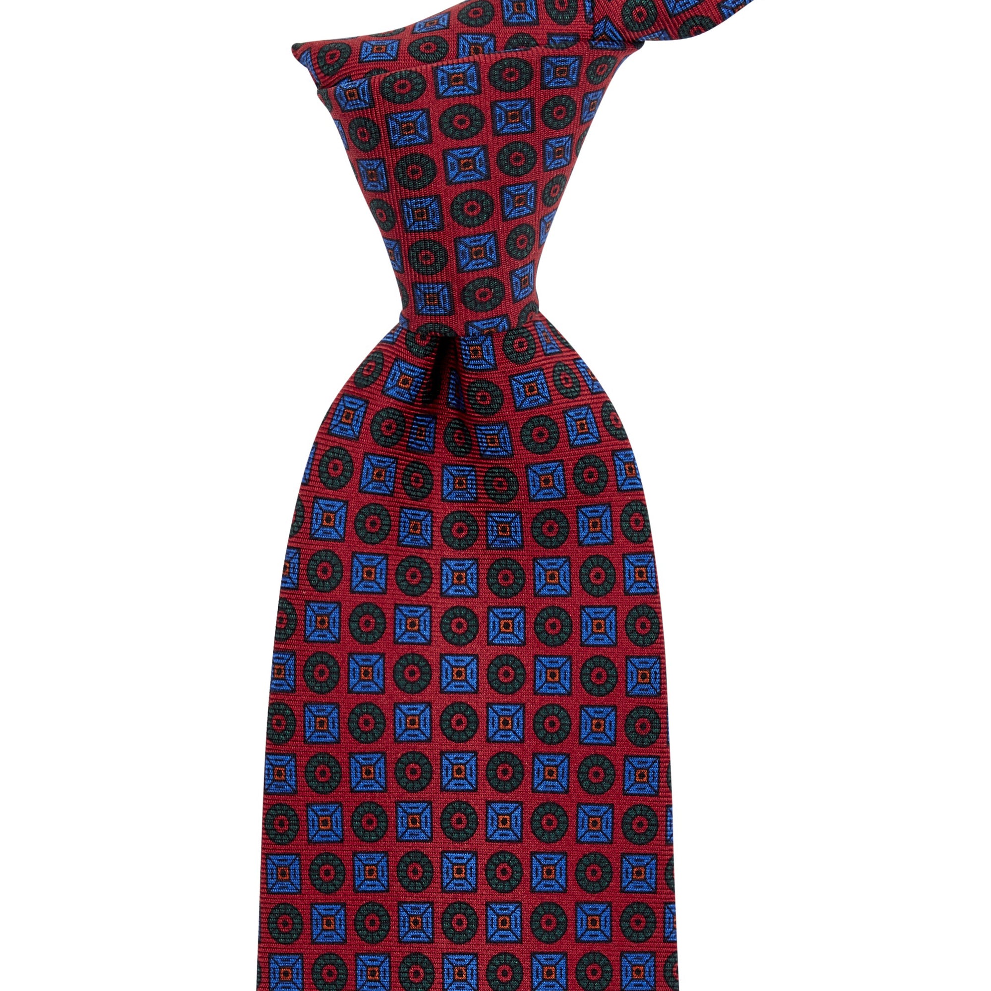 A Sovereign Grade Rust Ancient Madder Tie by KirbyAllison.com, handmade and high-quality, with a red, blue and white pattern.