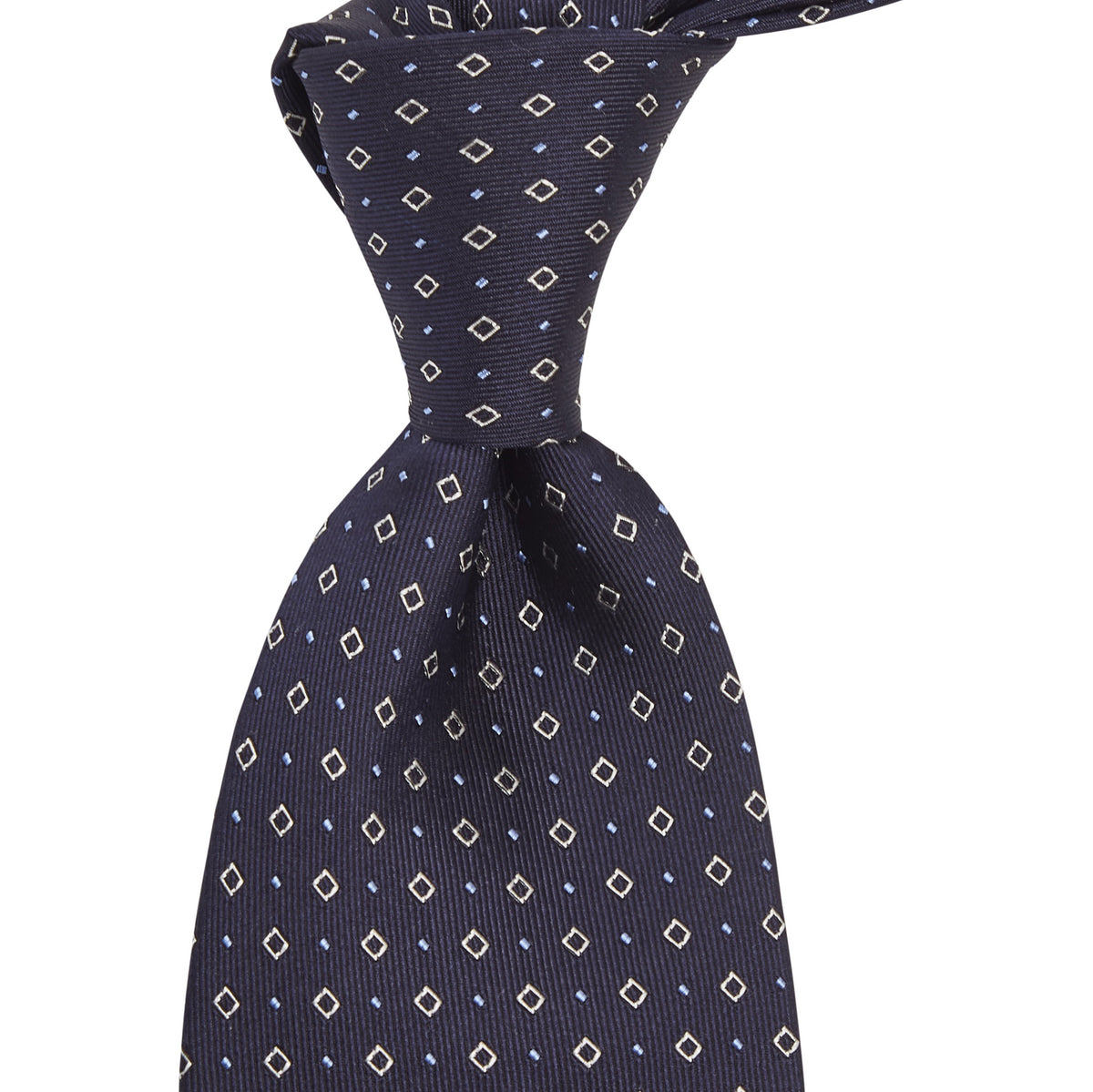 A handmade Sovereign Grade Midnight Blue Alternating Square Dot Jacquard Tie from KirbyAllison.com with a black and white polka dot pattern.