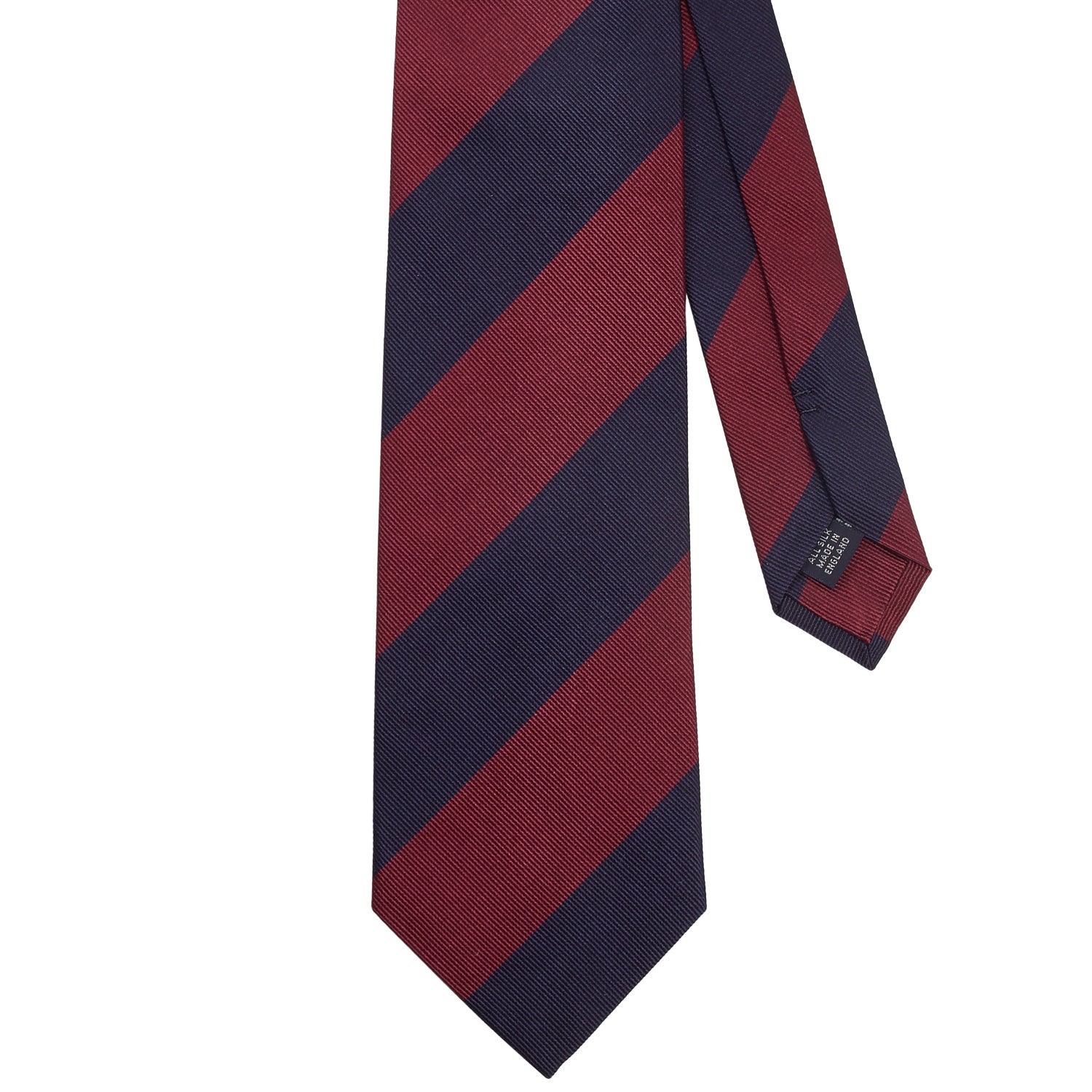 A handmade Sovereign Grade Midnight/Oxblood Household Guards (Blues and Royals) tie in burgundy and navy stripes on a white background by KirbyAllison.com.