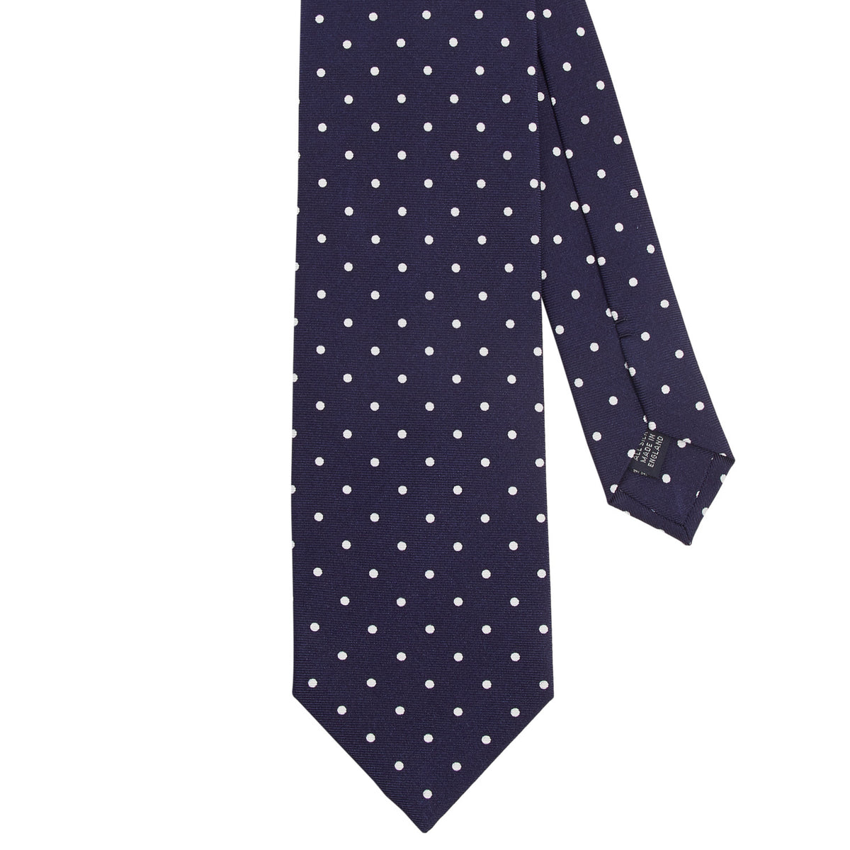 A KirbyAllison.com Sovereign Grade Navy White London Dot Printed Silk Tie on a white background.